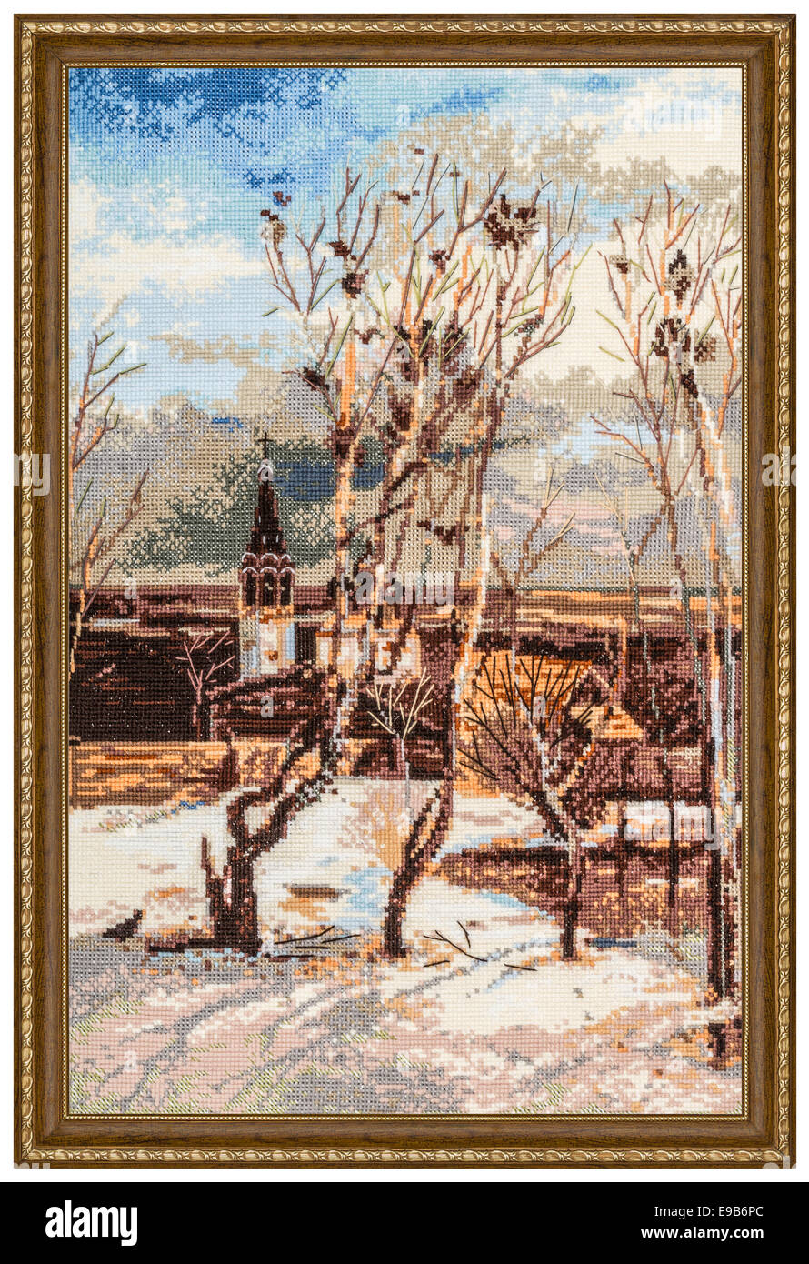 Embroidered picture in the frame, isolated on white background Stock