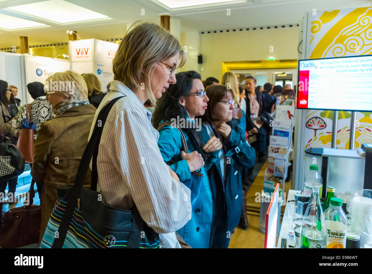 Paris, France. Trade Show, 15th Congress of SFLS, French Society in FIght against AIDS, N.G.O's, and Drug Companies. Women looking at VIIIV Pharmaceuticals Company Stall, pharma industry Stock Photo