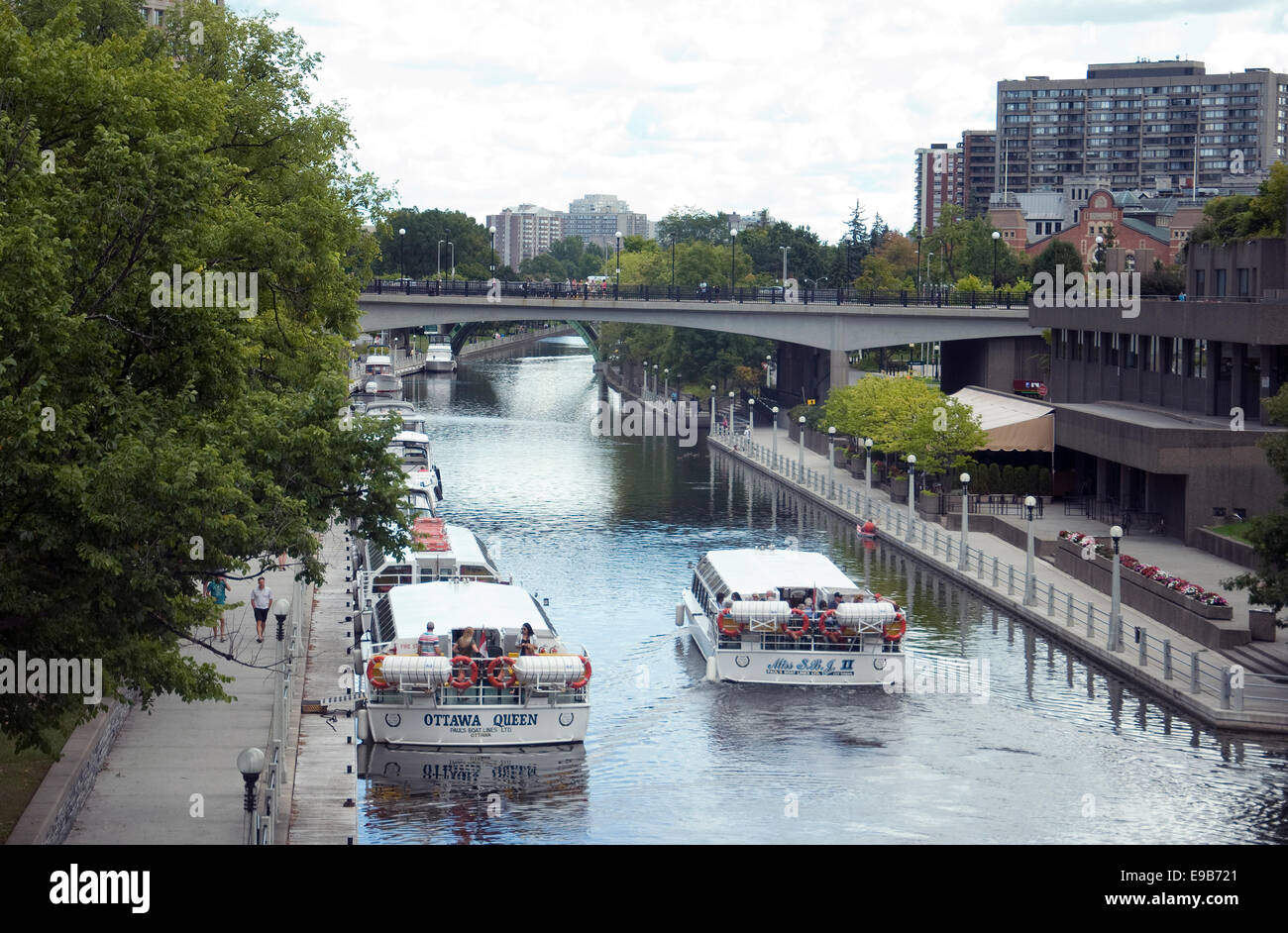 Cruiseboats delight summer tourists to Ottawa's Rideau Canal, a waterway 202-km  in length, with Unesco heritage status Stock Photo