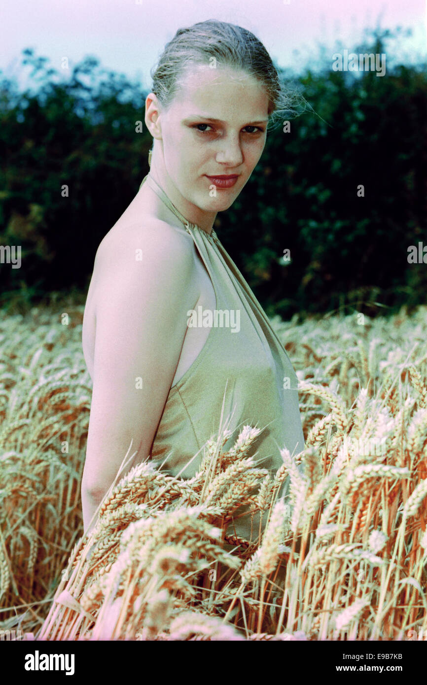 young female aspiring model poses for portfolio photographs during the