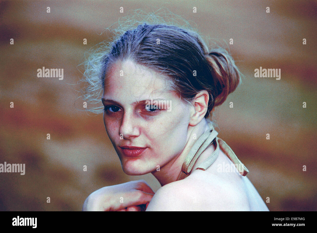 young female aspiring model poses for portfolio photographs during the