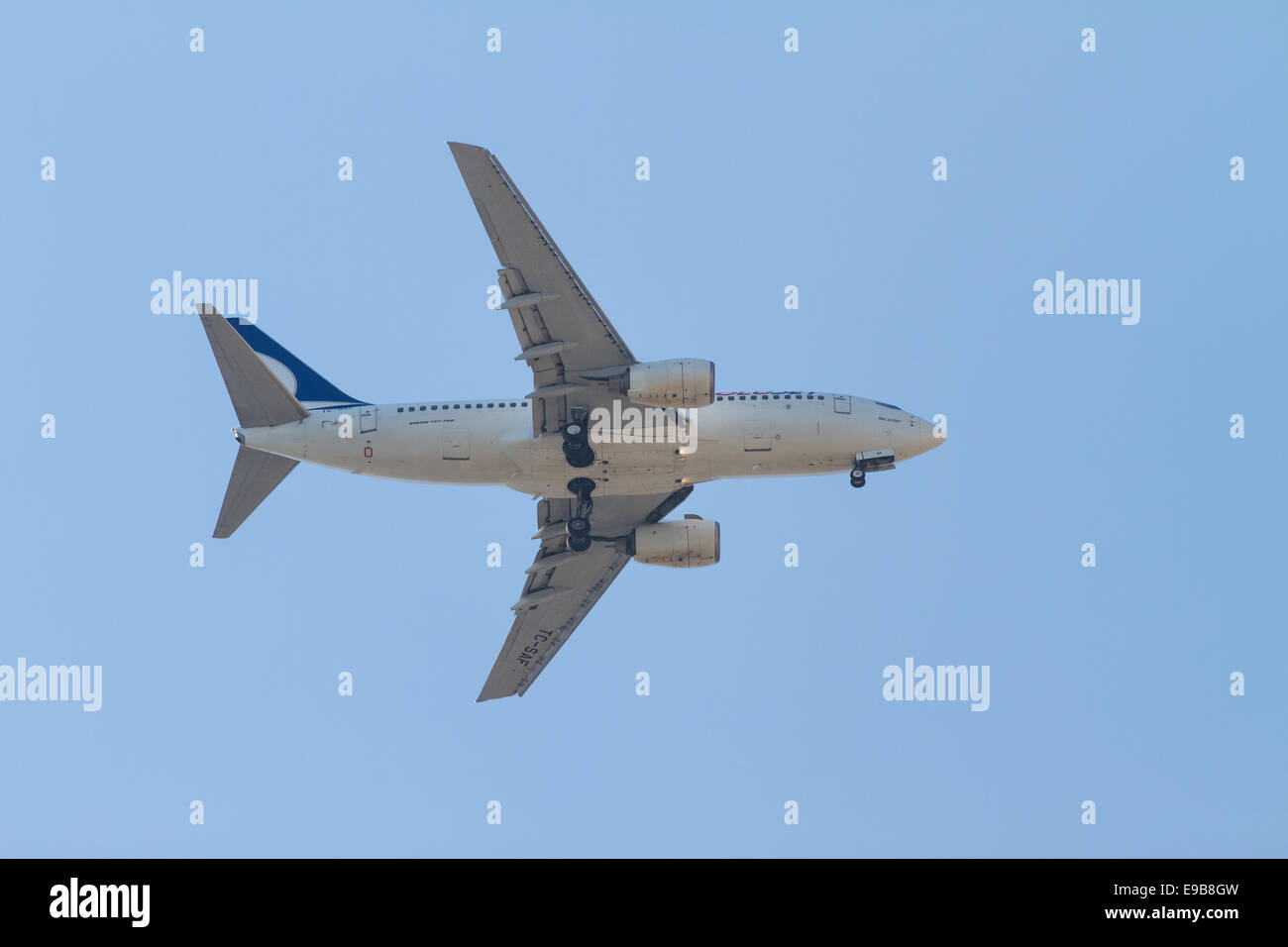 ISTANBUL, TURKEY - JULY 13, 2014: AnadoluJet Boeing 737-700 landing to Sabiha Gokcen Airport. AnadoluJet is low-cost branch of T Stock Photo