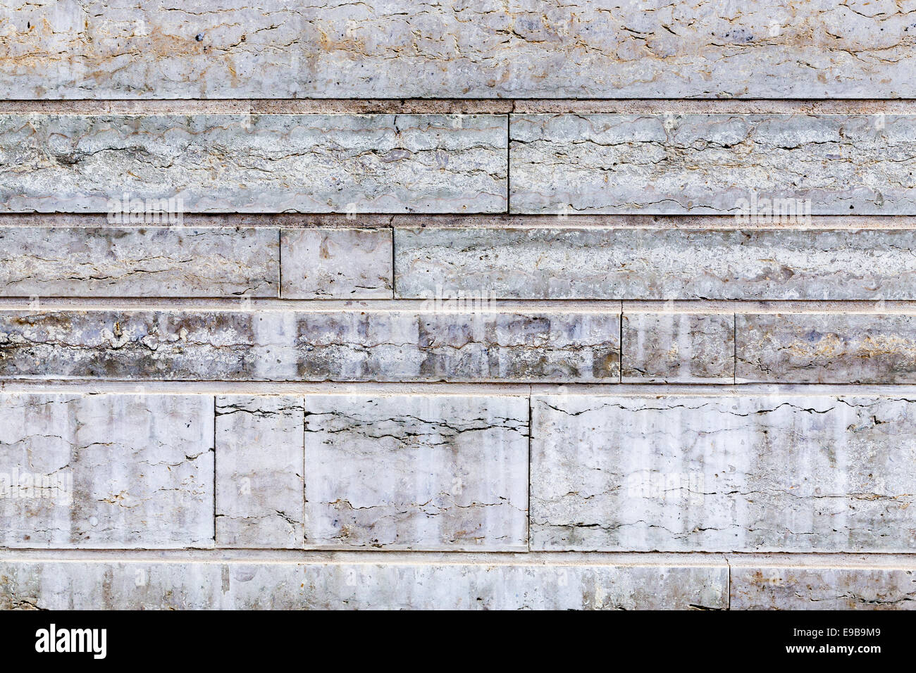 Grungy stone wall background as a texture Stock Photo - Alamy