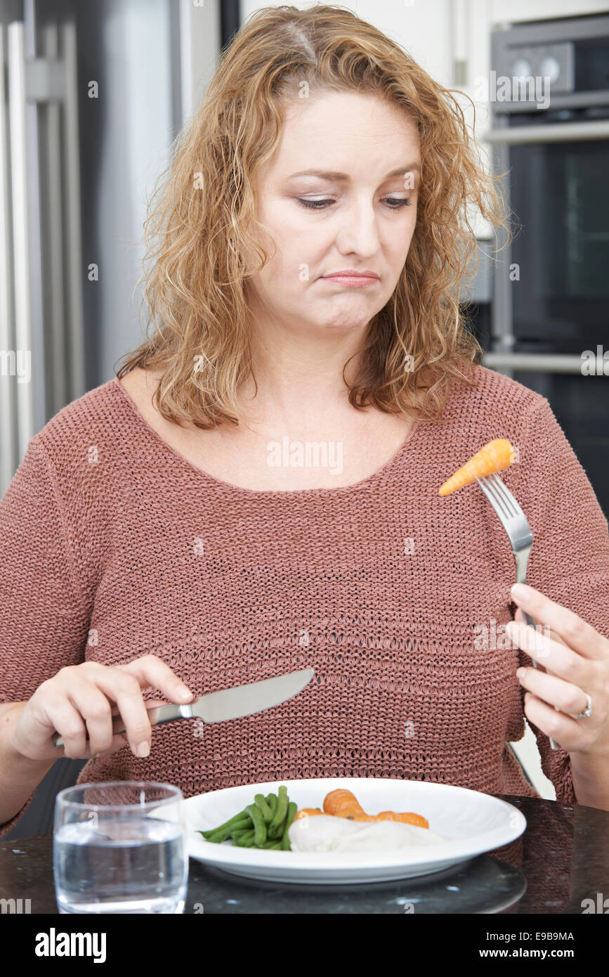 Woman On Diet Fed Up With Eating Healthy Meal Stock Photo