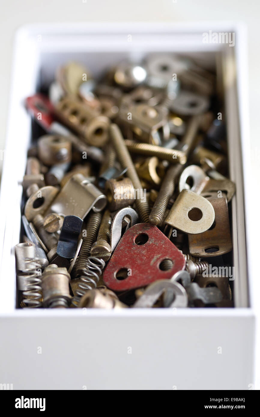 Box of brackets, bolts and springs Stock Photo