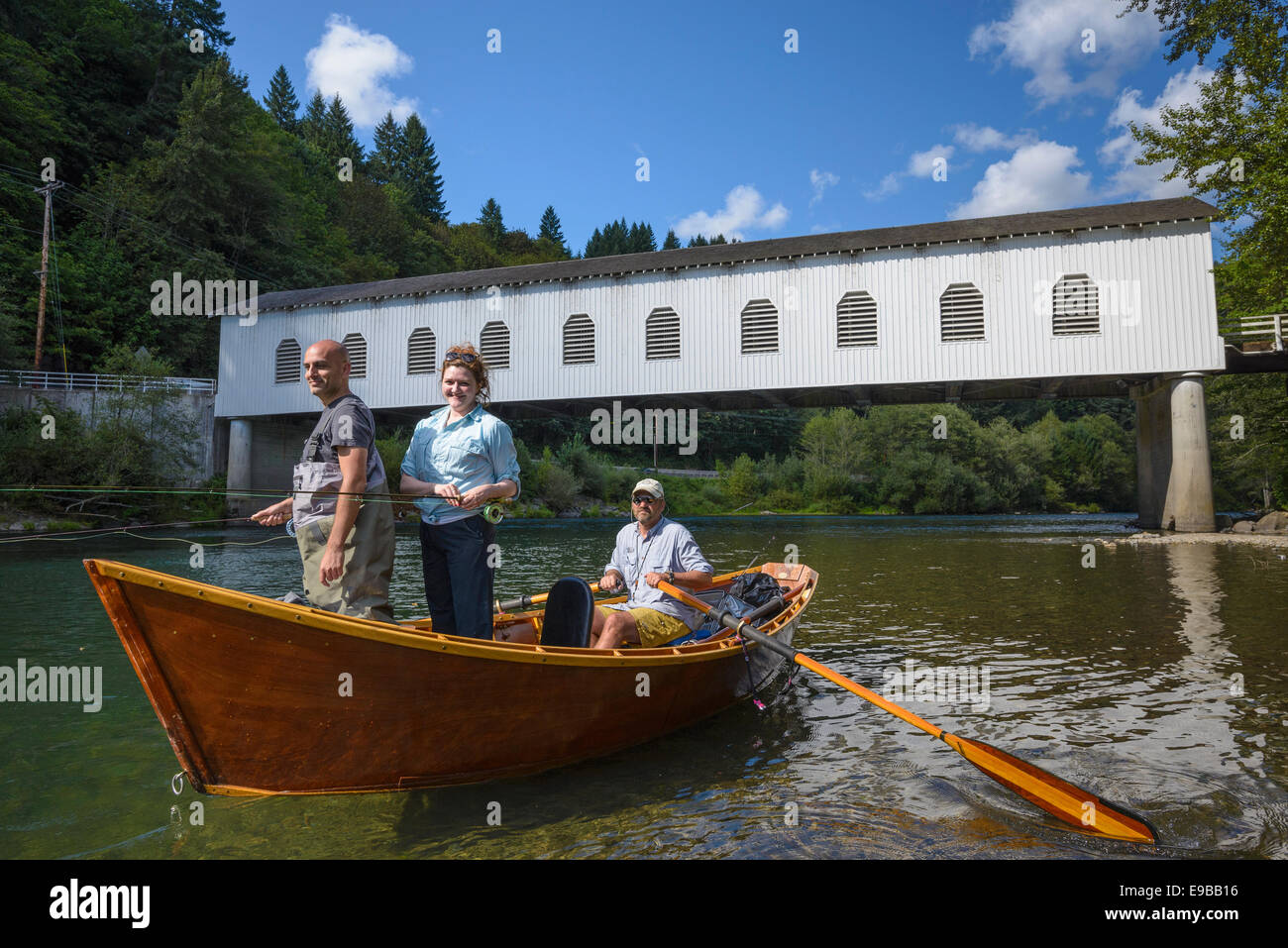 Drift boat fishing on the McKenzie River at Goodpasture Bridge with guide Greg Hatten and Wooden Boat Adventures; Lane County, O Stock Photo