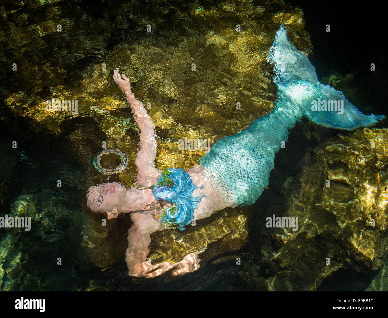 Mermaid blowing cirular bubble underwater in Yucatan Peninsula, KuKulKan Cenote, QRoo, Mexico Stock Photo