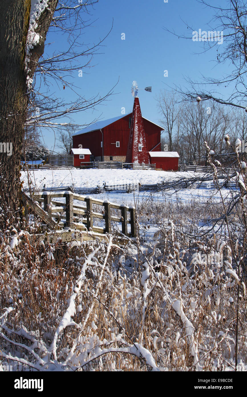 Red Barn In Winter Snow. Historic Barn. Old red barn at Carriage Hill