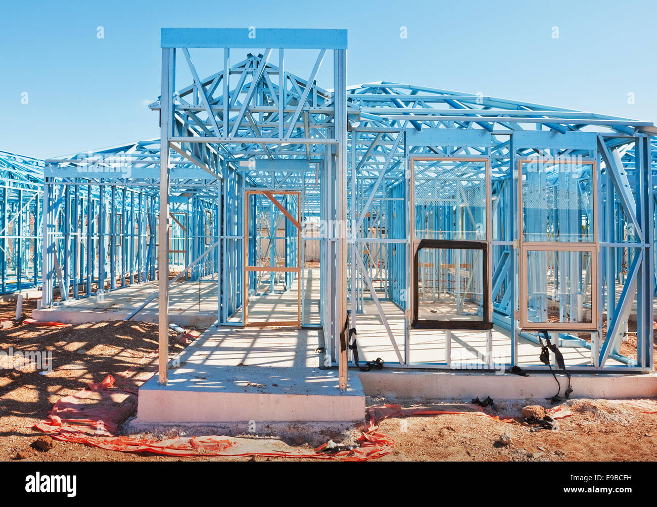 New residential construction home metal framing against a blue sky Stock Photo