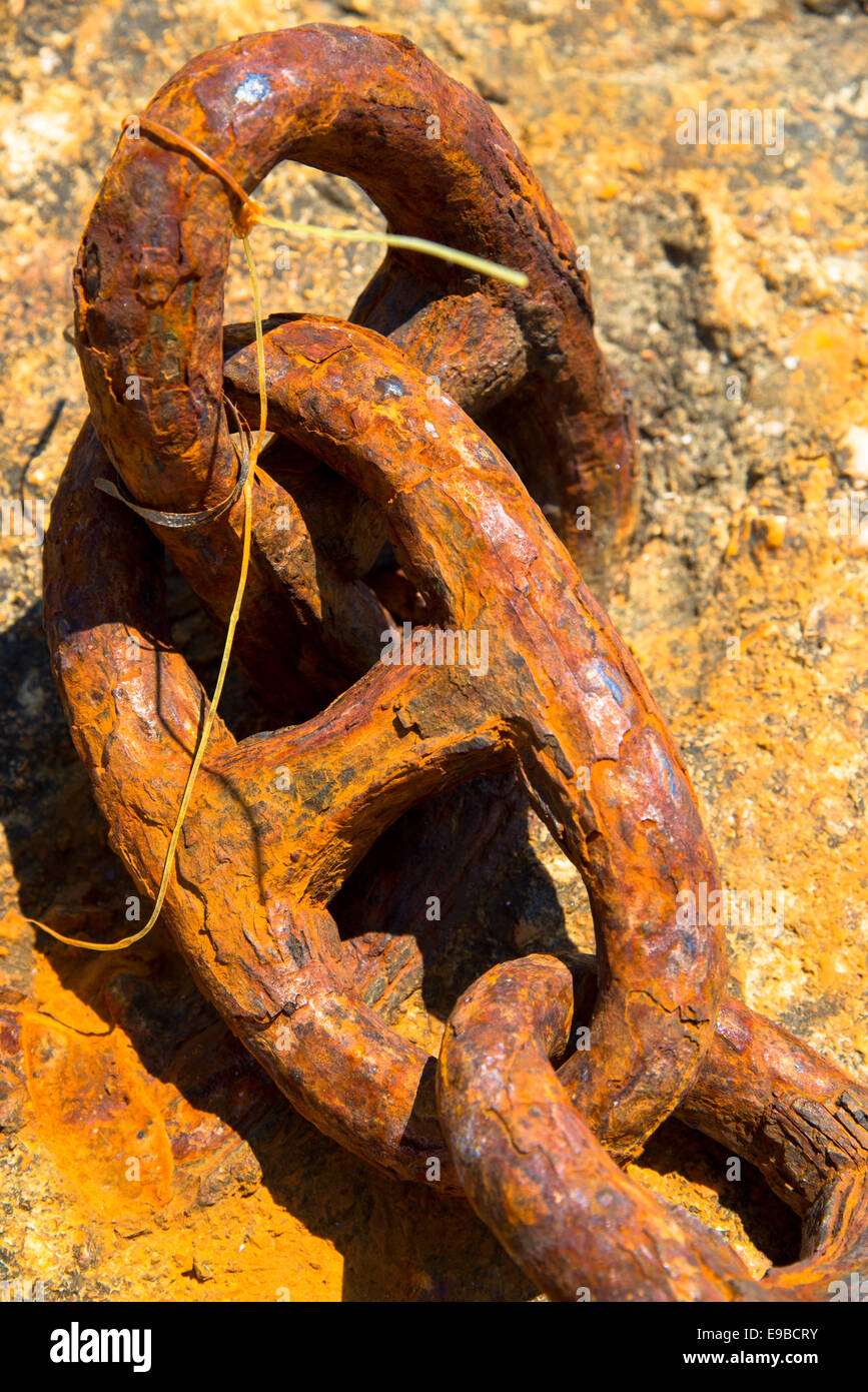 weathered chain in harbor greece Stock Photo