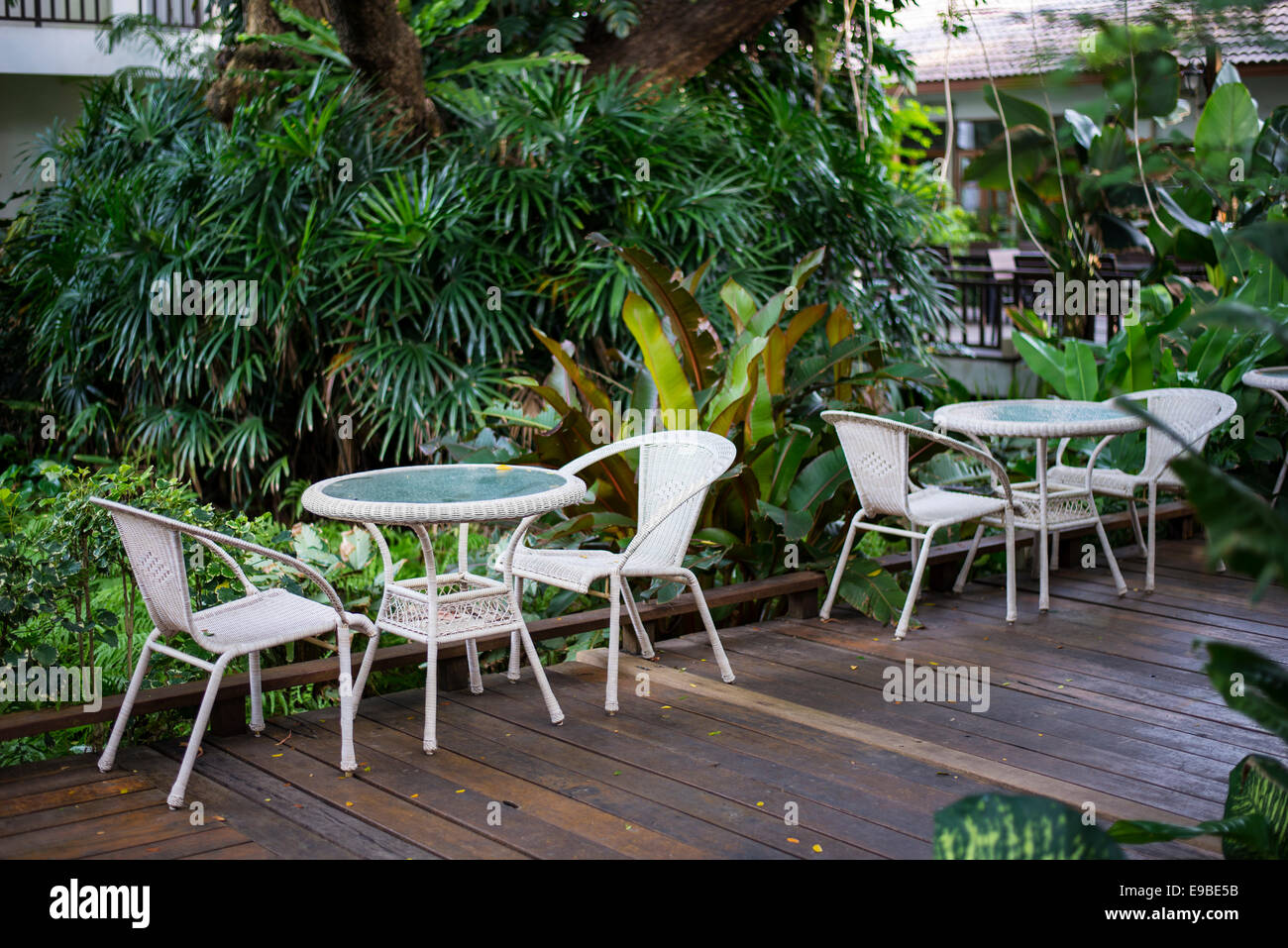 Table and chairs in a garden Stock Photo