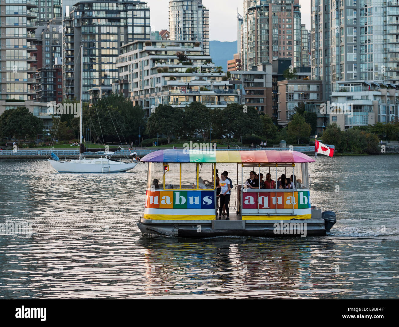 An Aquabus ferry boat transports passengers on False Creek's waterway, Vancouver, Canada Stock Photo