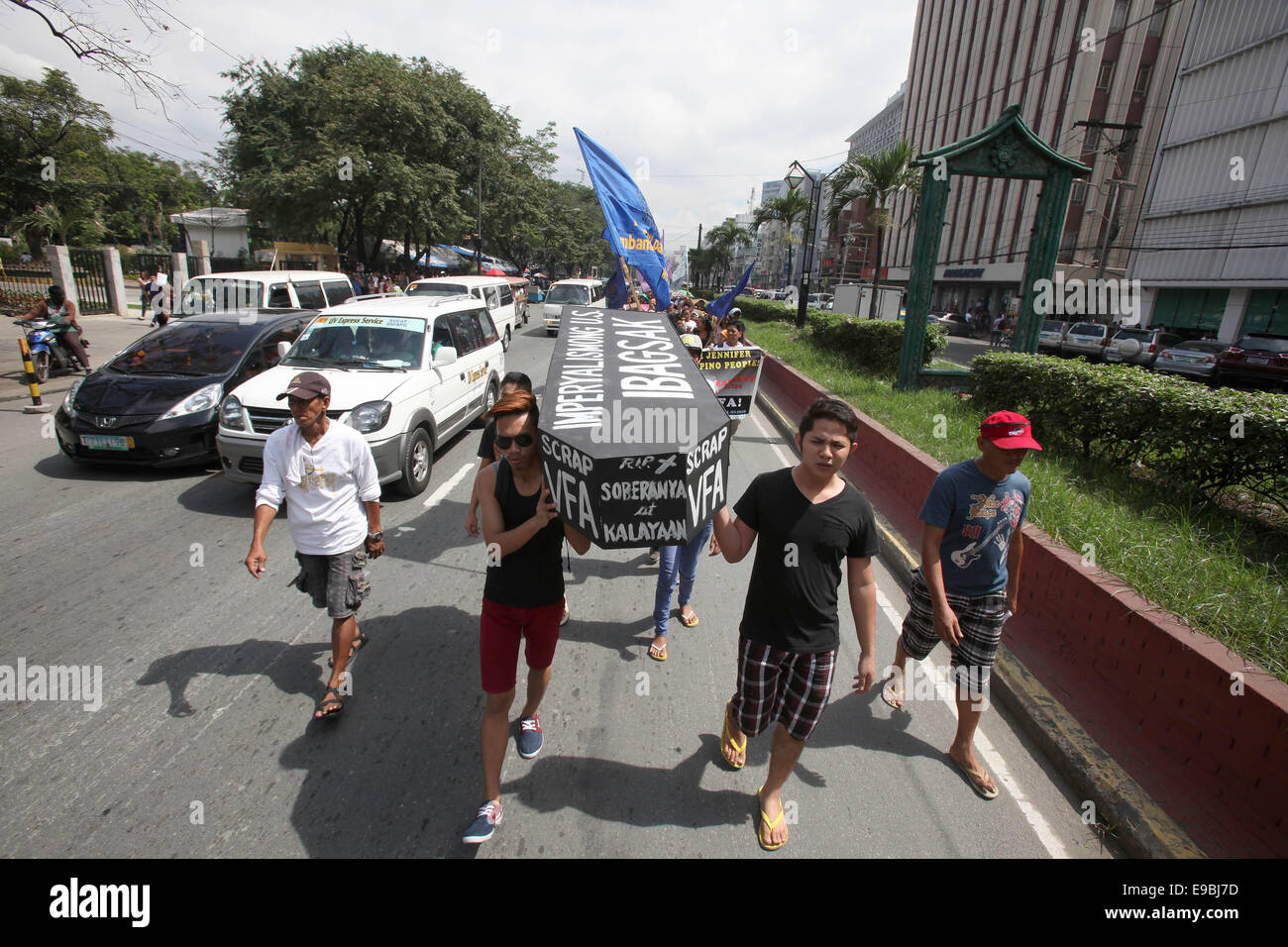 Manila. 24th Oct, 2014. Activists carry a mock coffin during a protest rally in front of the US Embassy in Manila, the Philippines on Oct. 24, 2014. The protesters demand justice for a Filipino transgender, Jeffrey 'Jennifer' Laude, who was allegedly killed by US Marine Private First Class Joseph Scott Pemberton. Credit:  Rouelle Umali/Xinhua/Alamy Live News Stock Photo
