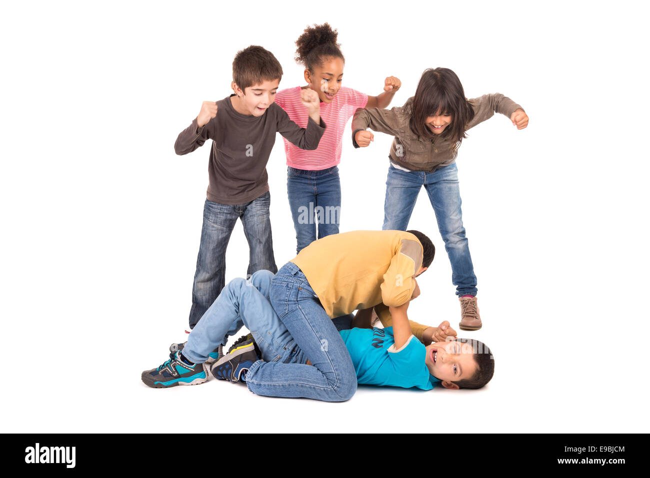 Boys fighting with other kids cheering isolated in white Stock Photo