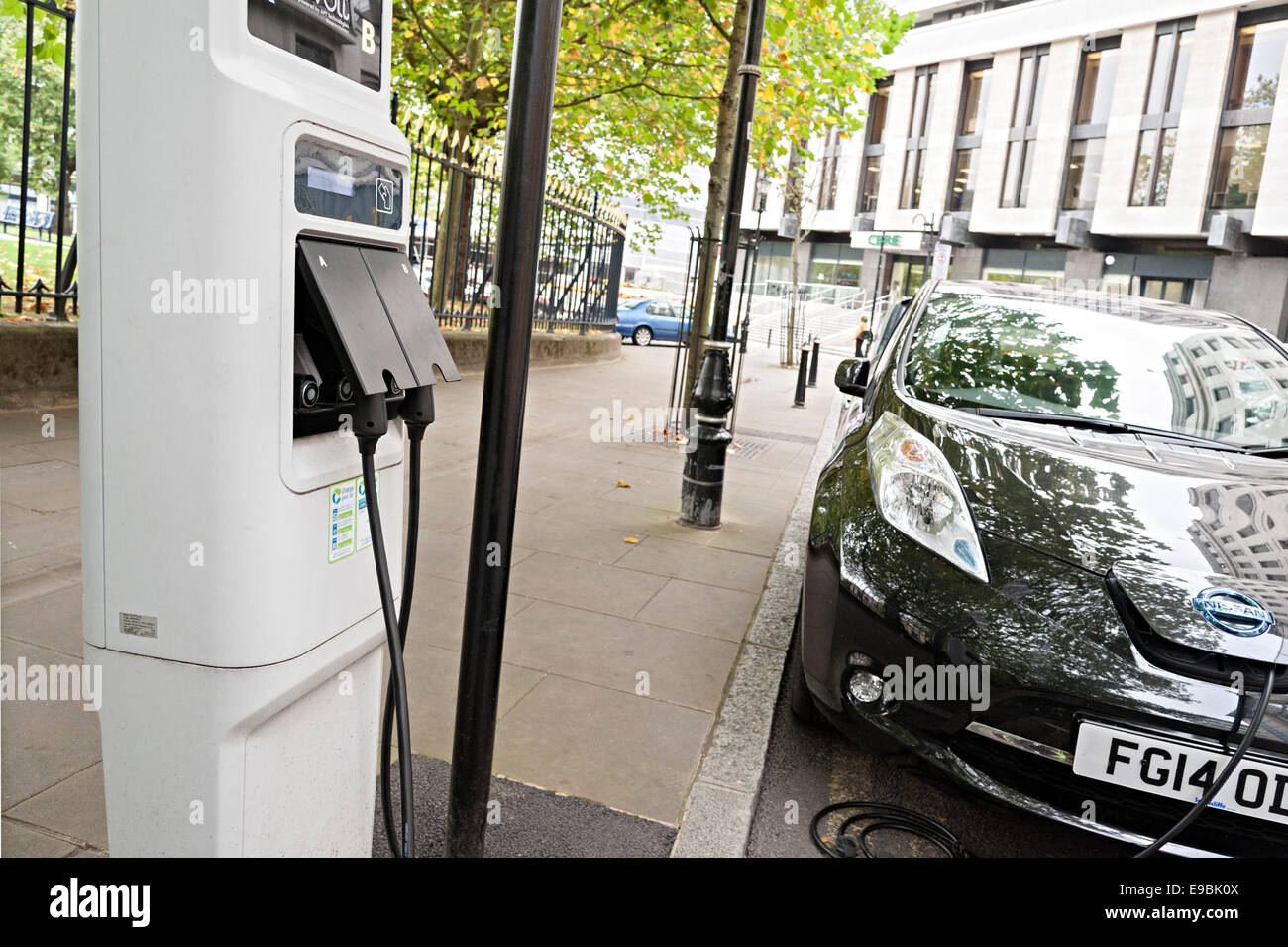 nissan leaf electric car charging in a Birmingham city center street