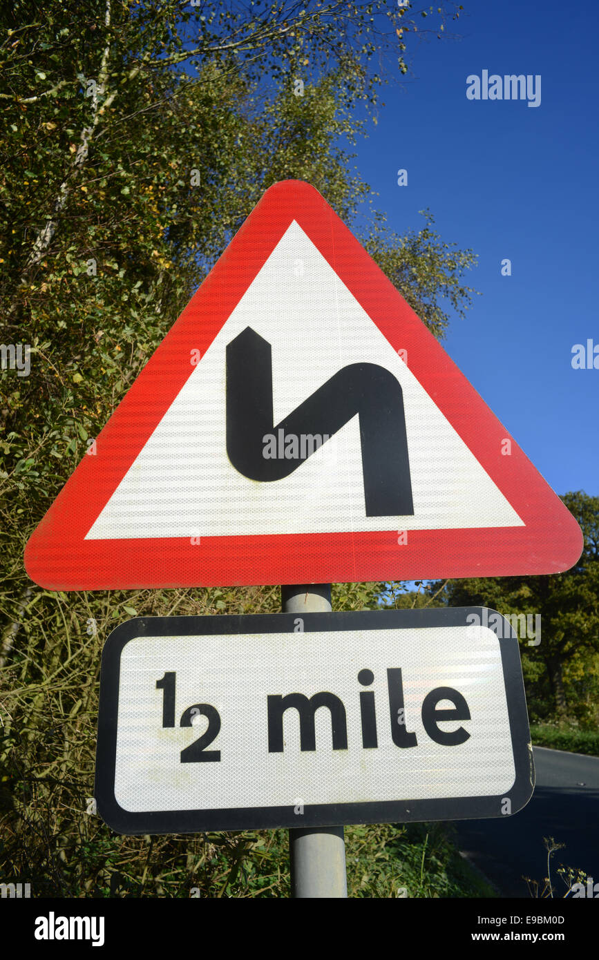 sharp bends in road ahead for half a mile yorkshire united kingdom Stock Photo