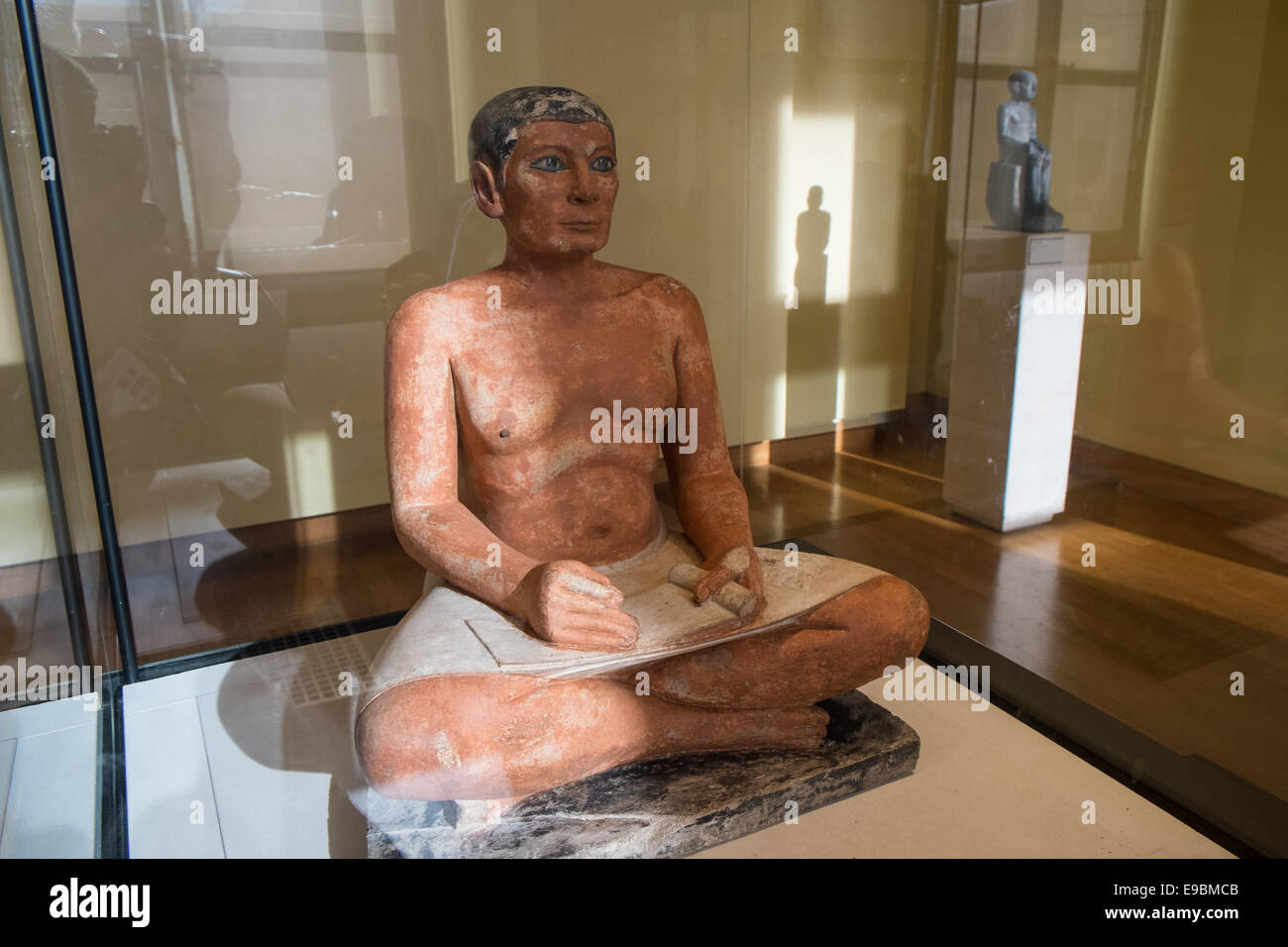 The sculpture of the Seated Scribe or Squatting Scribe is one of the most important examples of ancient Egyptian art. Louvre. Stock Photo