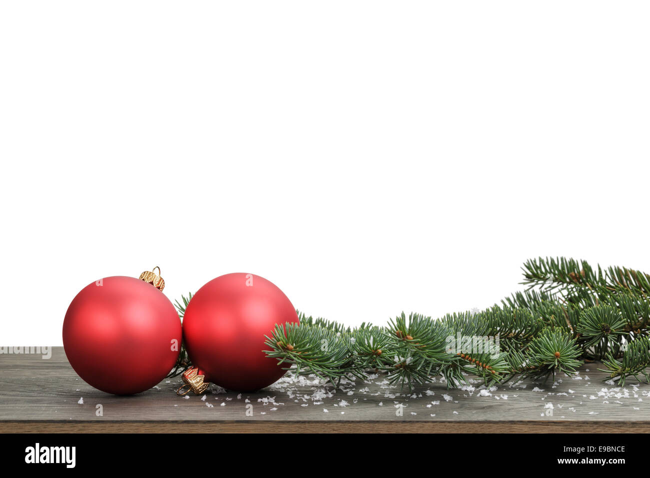 traditional red balls and fir branch with fake snow, white background ...