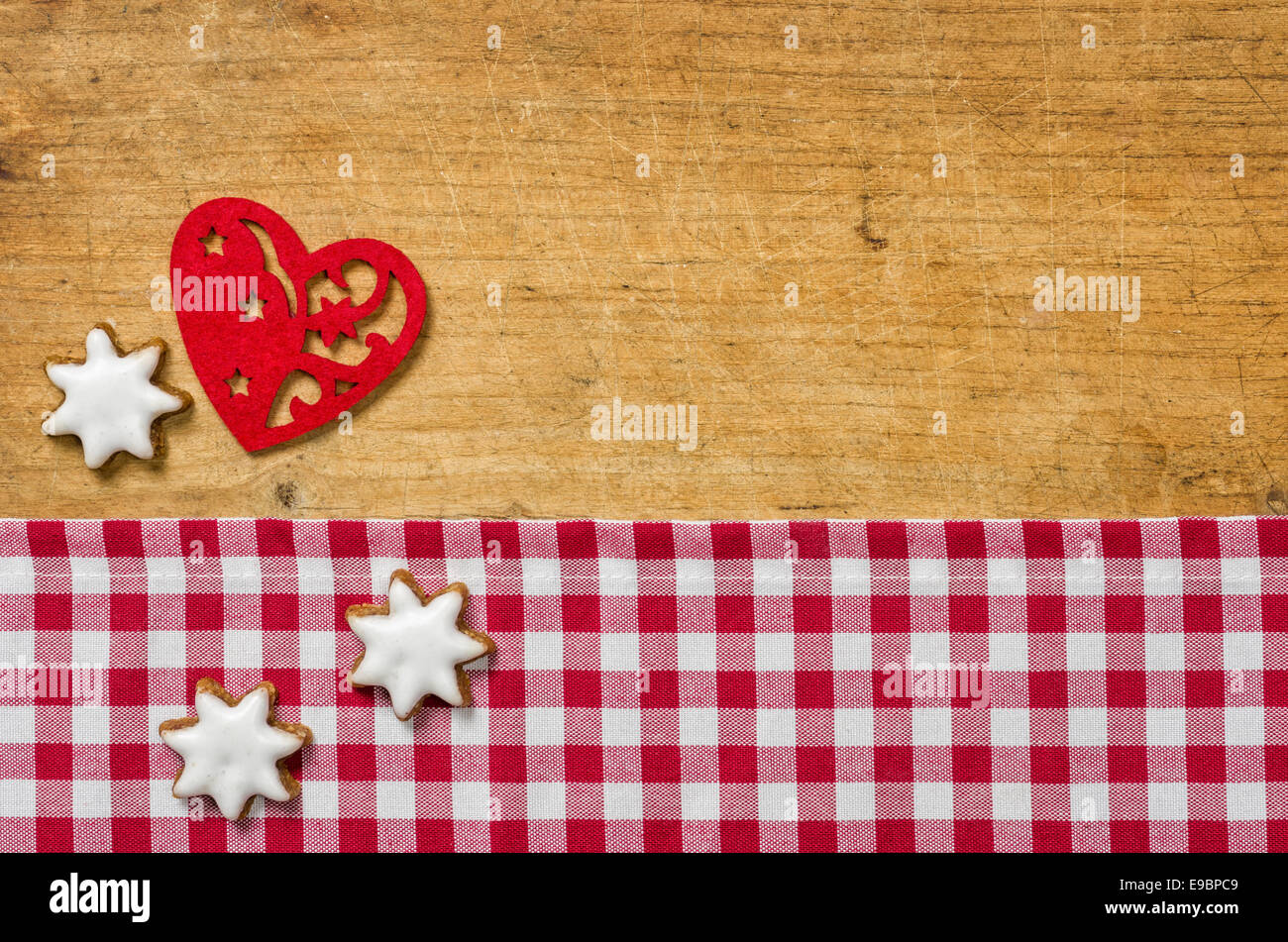 Wooden background with cookies and a felt heart Stock Photo - Alamy