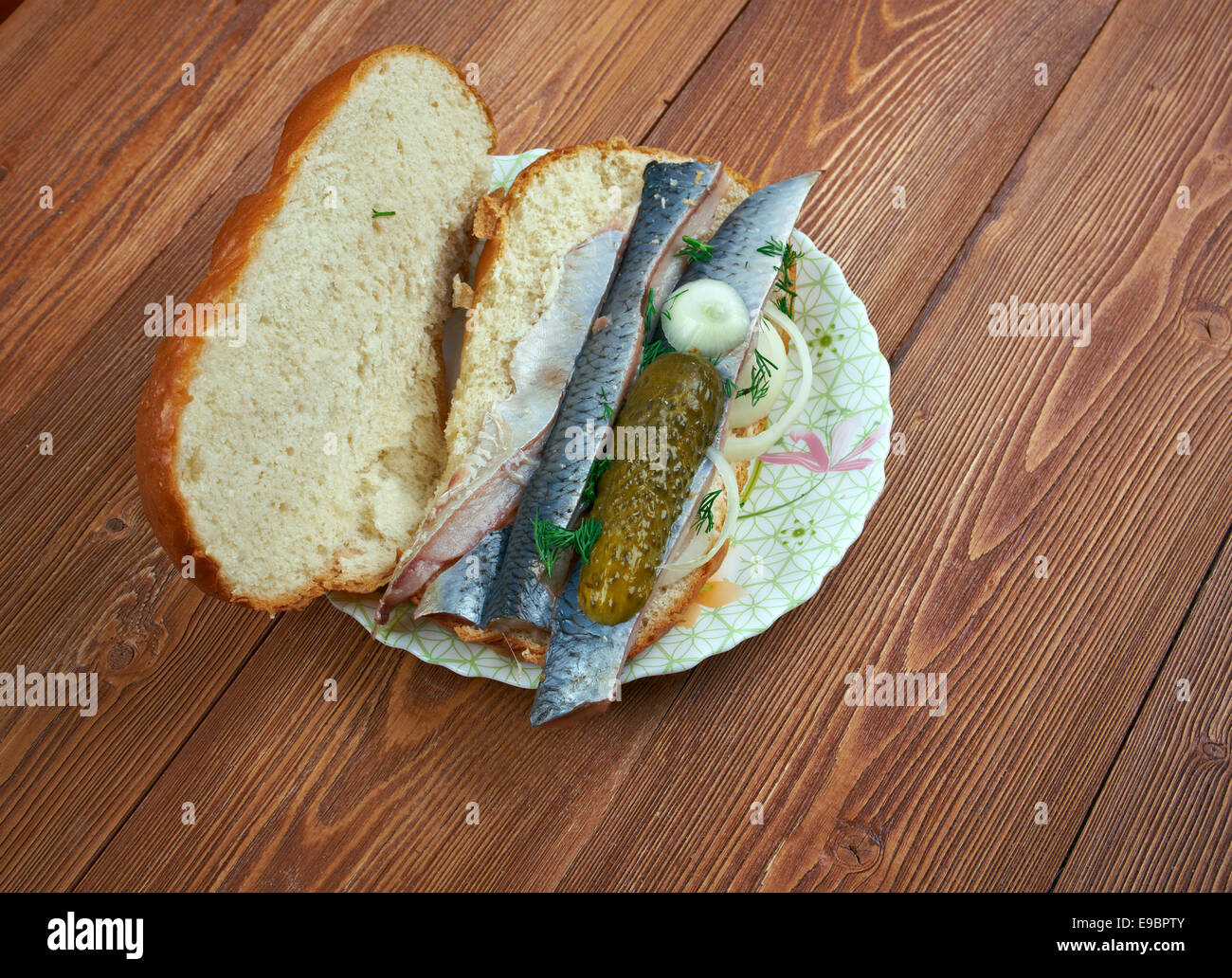 Traditional Dutch sandwich with marinated herring and cucumbers Stock