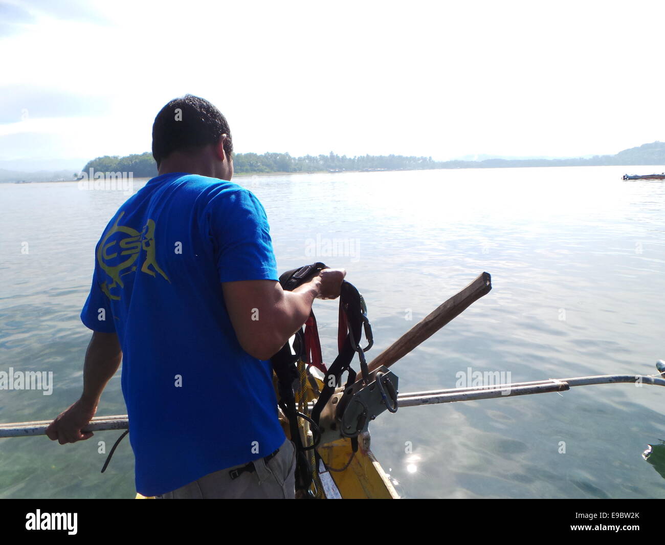 A zipline operator transporting zipline crawlers and pulley after a