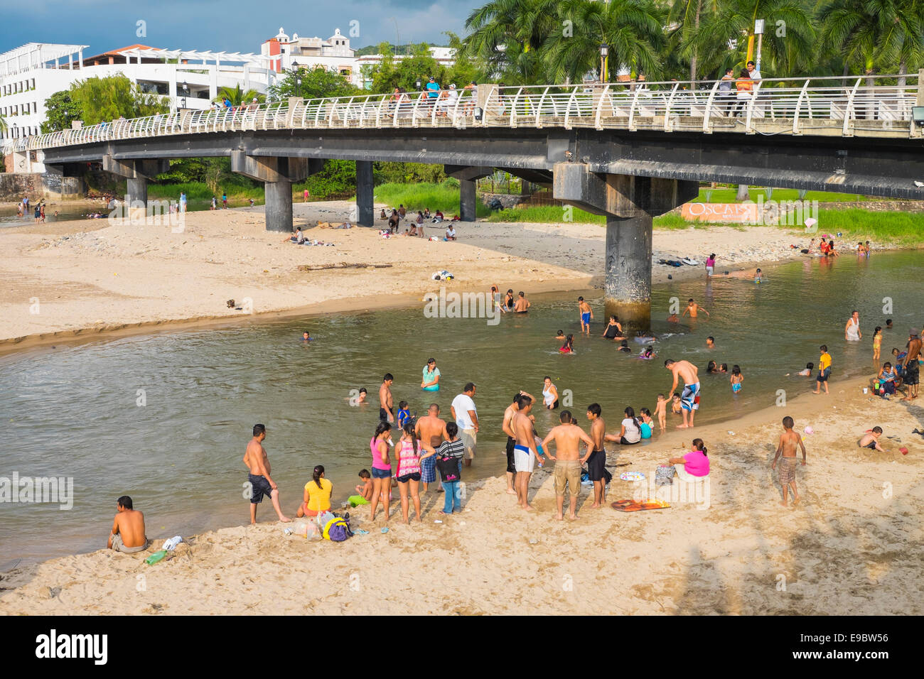 Mexican people enjoying a Sunday afternoon bath at the mouth of Rio