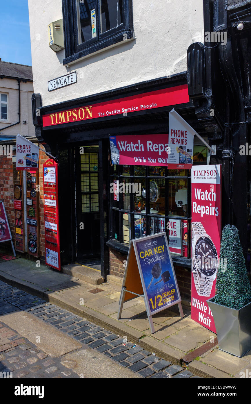 Entrance door of a Timpson store shop in York. Timpson stores repair watches and shoes and cut keys amongst other things. Stock Photo