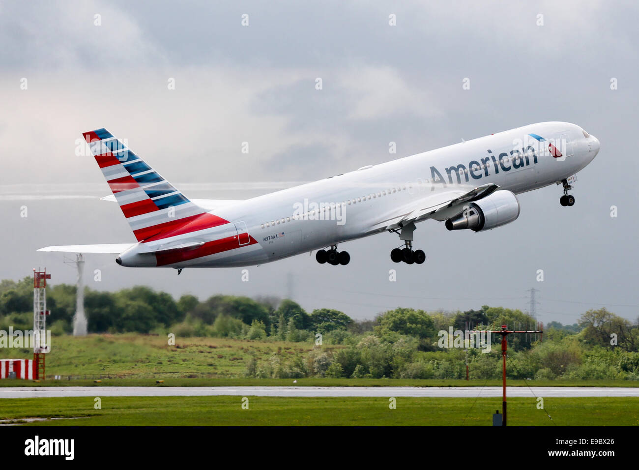 American Airlines Boeing 767-300 climbs away from 23R at Manchester airport. Stock Photo