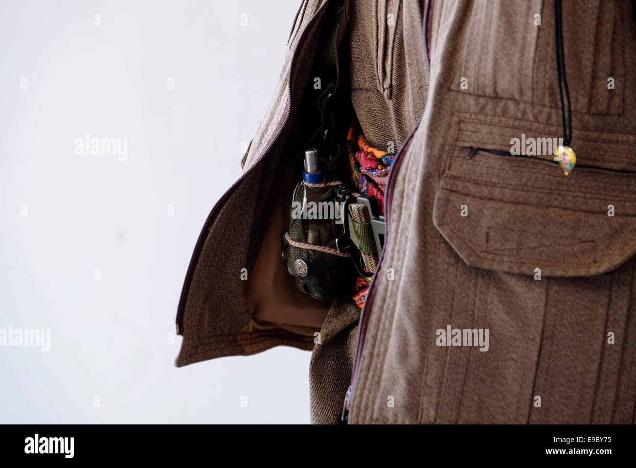 A female Kurdish fighter of the Free Women's Units shortened as YJA STAR the women's military wing of the Kurdistan Workers' Party PKK with a hand grenade stuck in her belt in Iraq Stock Photo