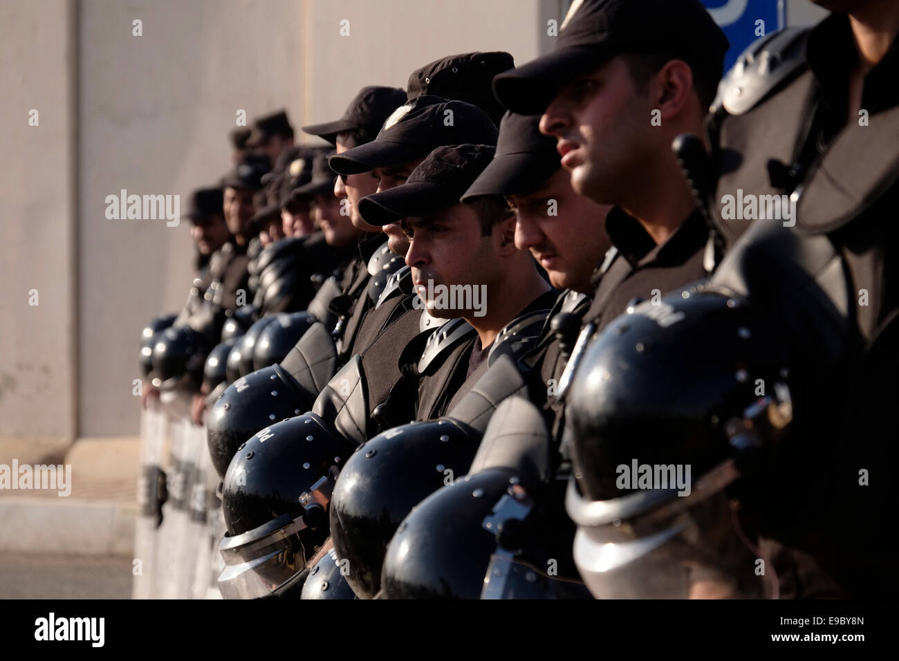 Kurdish riot police stand guard in front of UN headquarters as thousands of Kurds demonstrated in front of the UN headquarters in the city of Arbil or Irbil to demand international support for the Syrian town of Kobane as it tries to resist a deadly jihadist assault. Northern Iraq Stock Photo