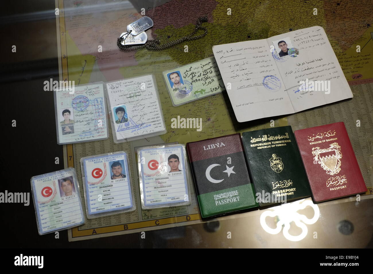 Collection of Turkish identity cards and foreign passports found on the bodies of ISIS or ISIL fighters displayed in the headquarter of the Kurdish People's Protection Units YPG in the city of Qamishli or Qamishlo in Al Hasakah or Hassakeh district in northern Syria Stock Photo