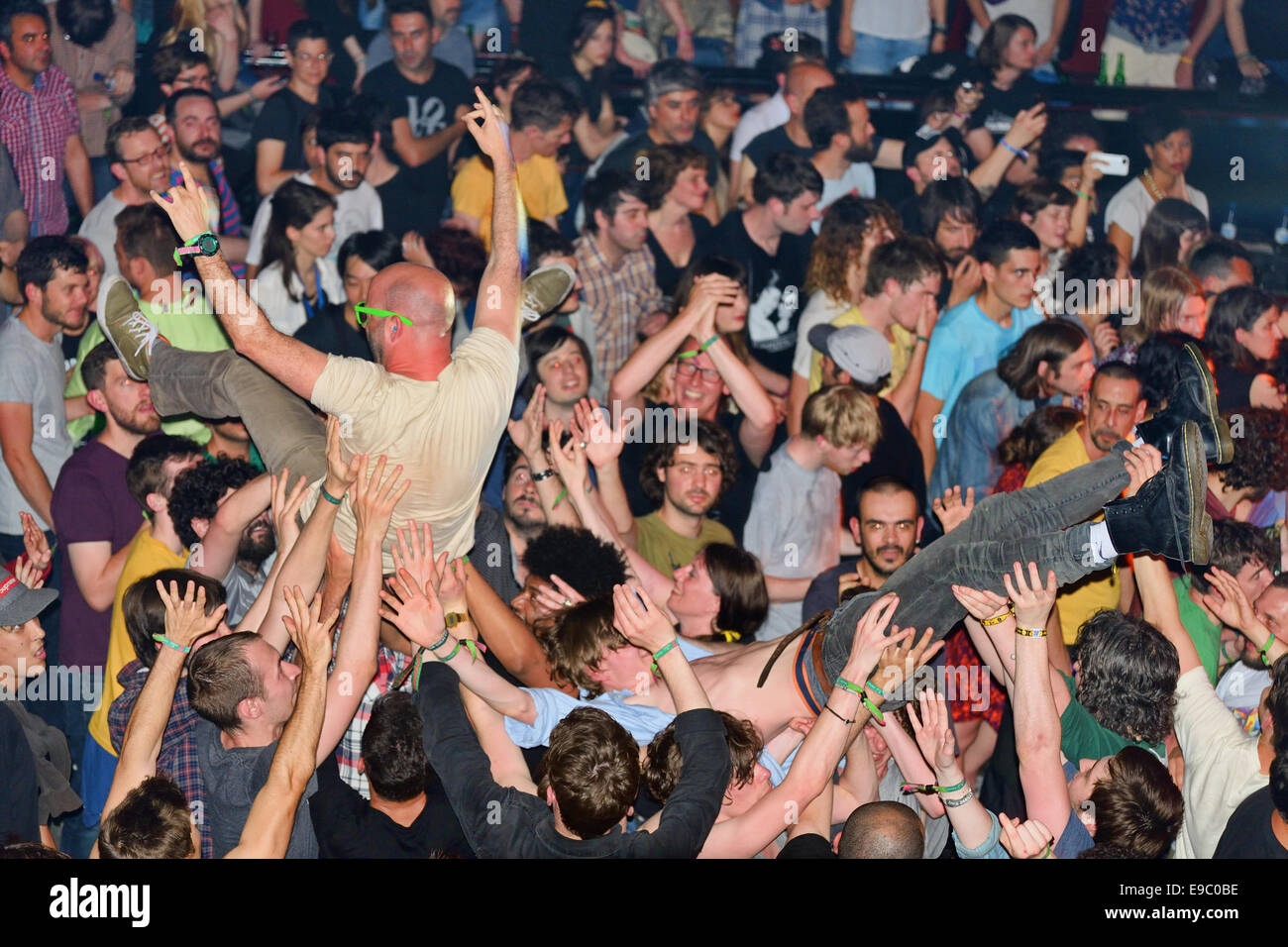 BARCELONA - MAY 30: The audience doing crowd surfing (also known as mosh pit) at Heineken Primavera Sound 2014 Festival. Stock Photo