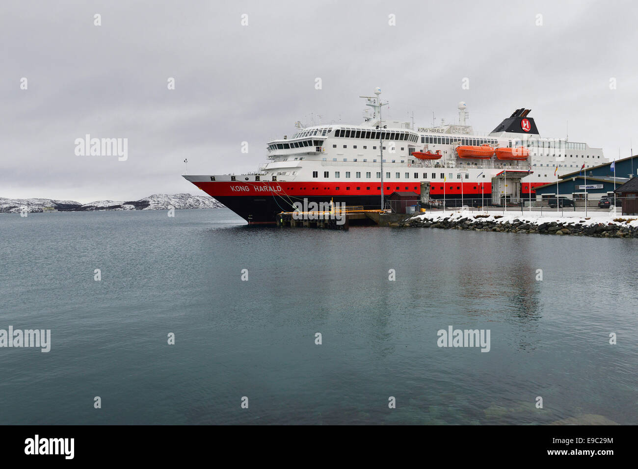 »MS Kong Harald« at the pier in Kirkenes under heavy clouds, 24 February 2014 Stock Photo