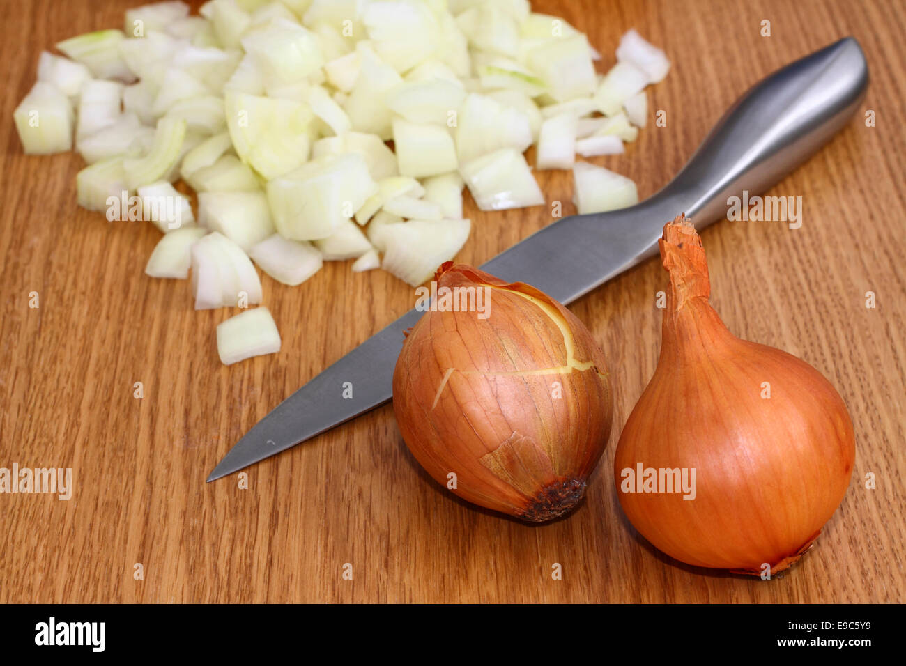 Onions being chopped on a chopping board Stock Photo Alamy