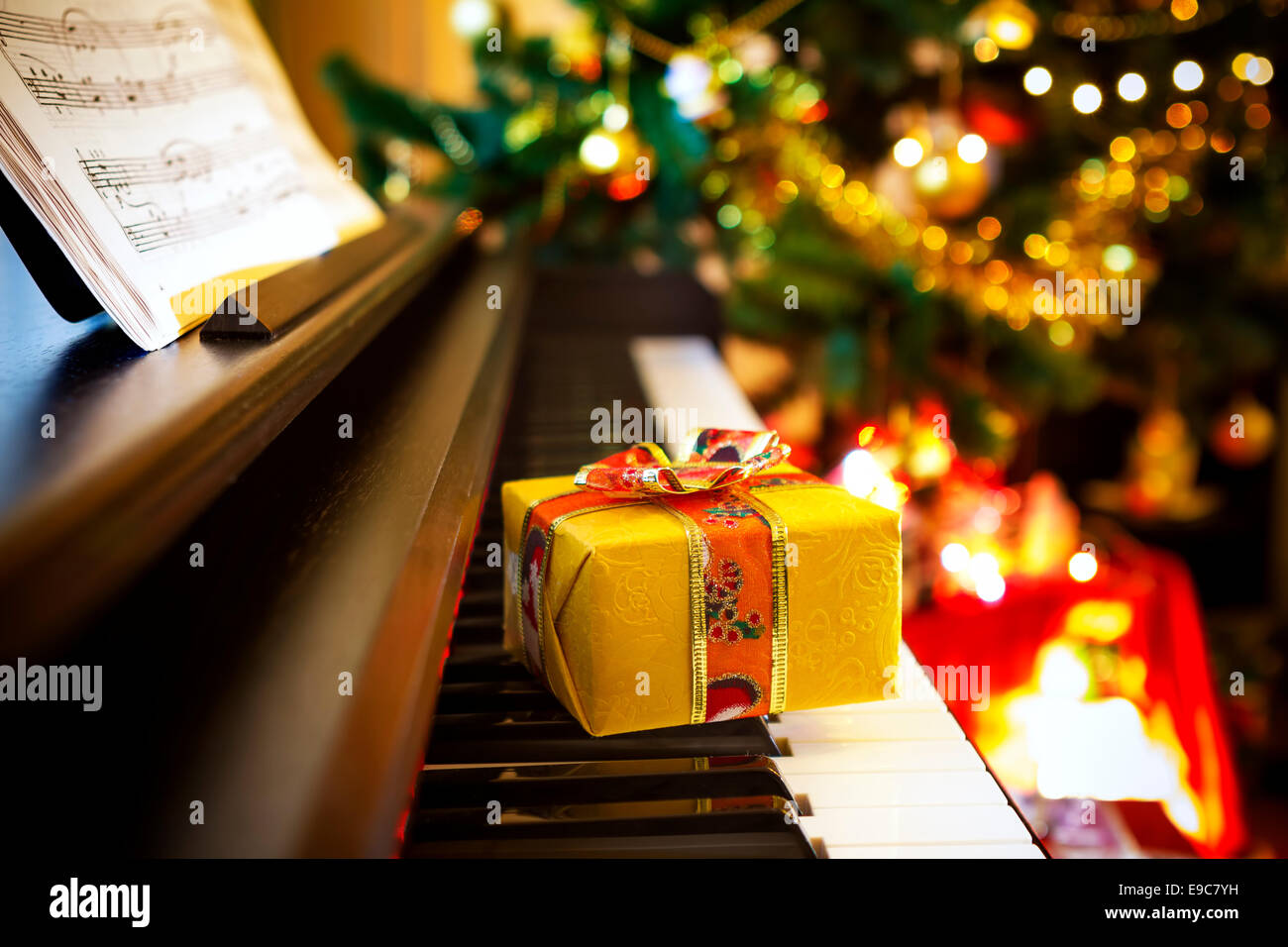 Christmas gift on piano. Christmas decoration with gift on piano Stock