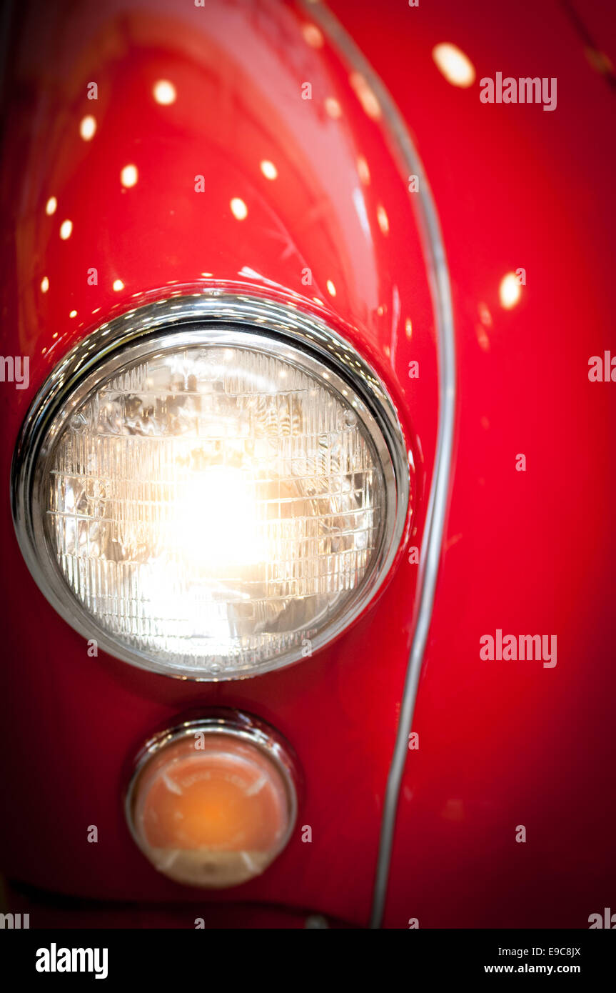 Close Up Detail of Headlight of Shiny Red Classic Car Stock Photo - Alamy