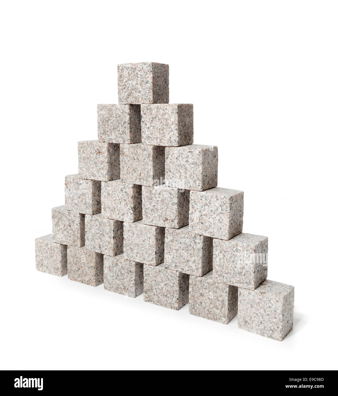 Pyramid made of small granite rock blocks. Stock Photo