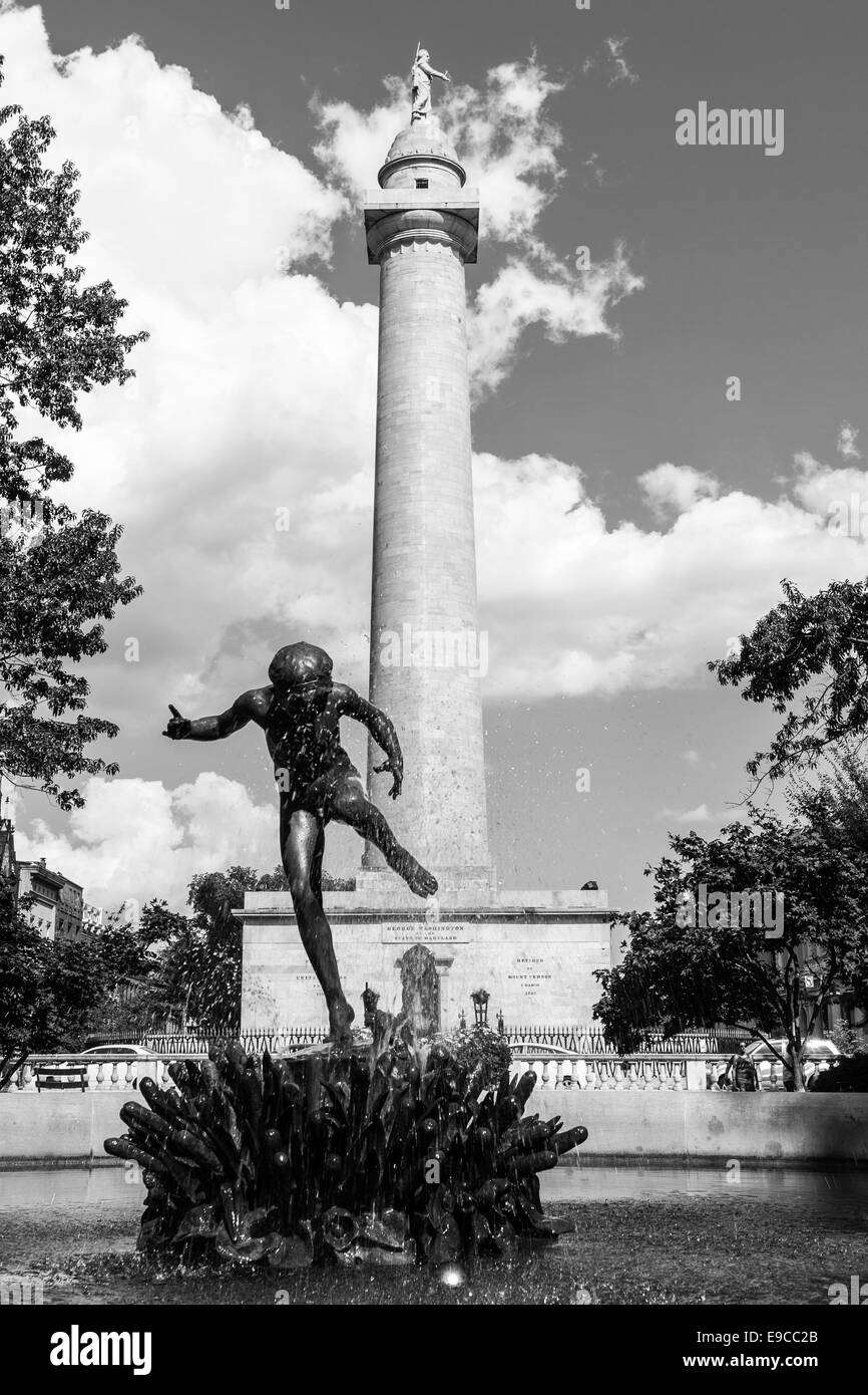 A cherub dances in the fountain in the west quadrant of Mt. Vernon Place in front of the Washington Monument in Baltimore, MD. Stock Photo