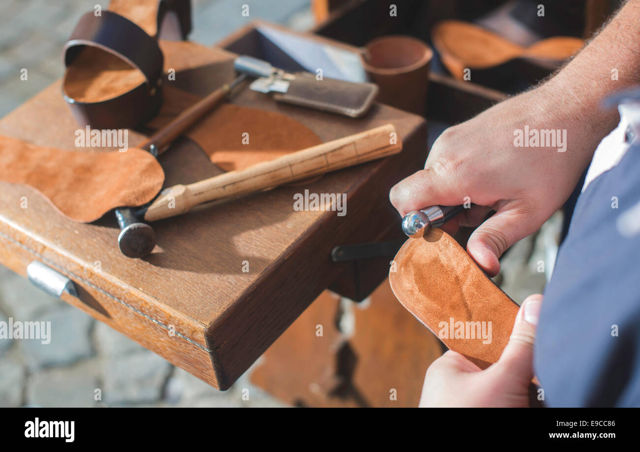 Hands making shoes. Shoemaker Stock Photo