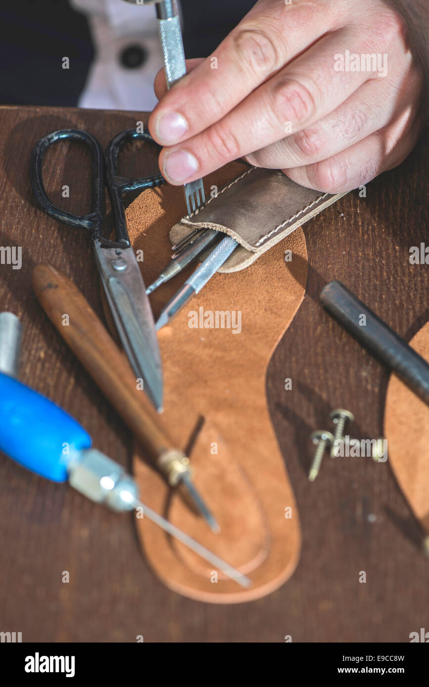 Making shoes manual. Leather sandals Stock Photo Alamy