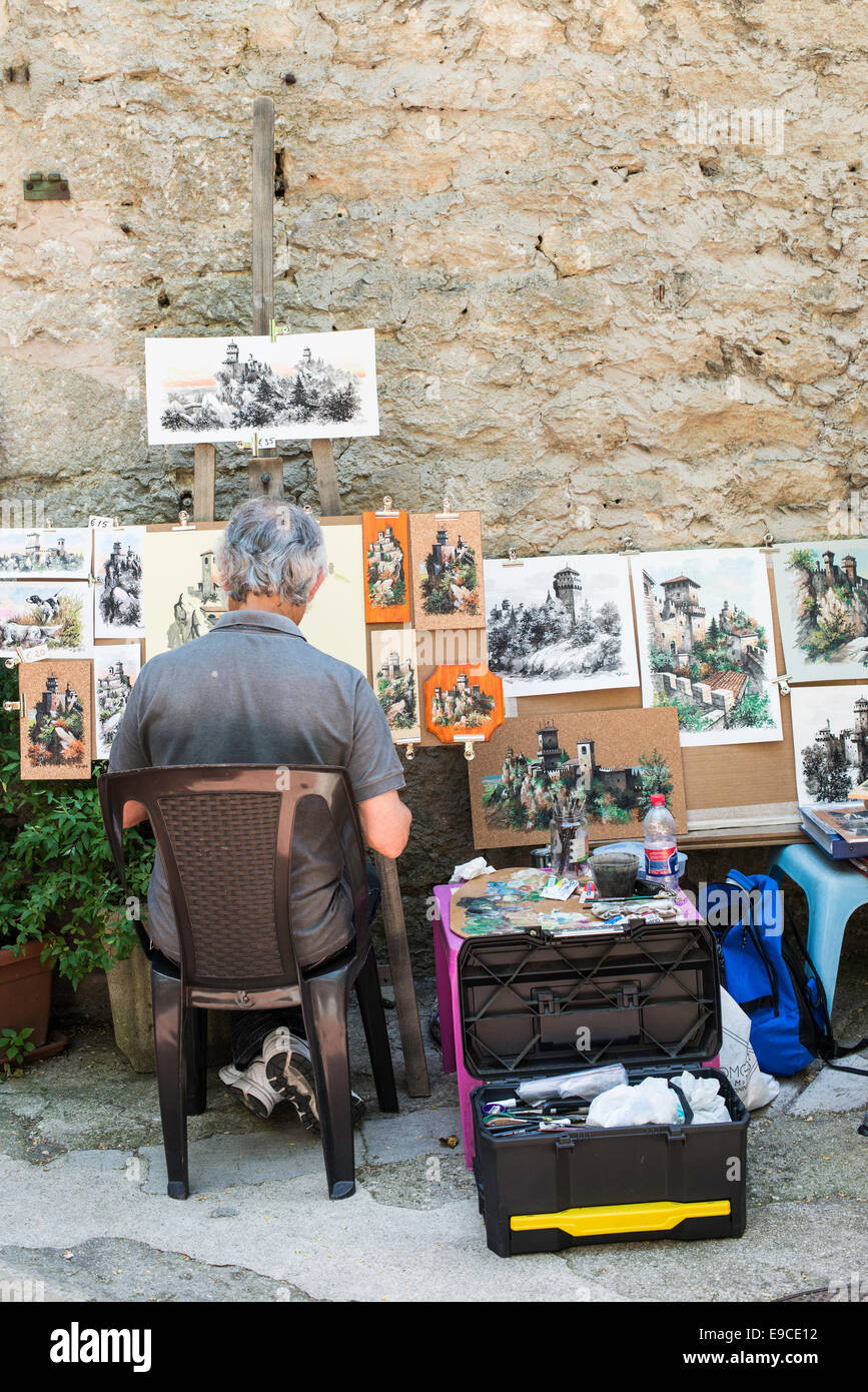 Artist painting on the street in San Marino Stock Photo
