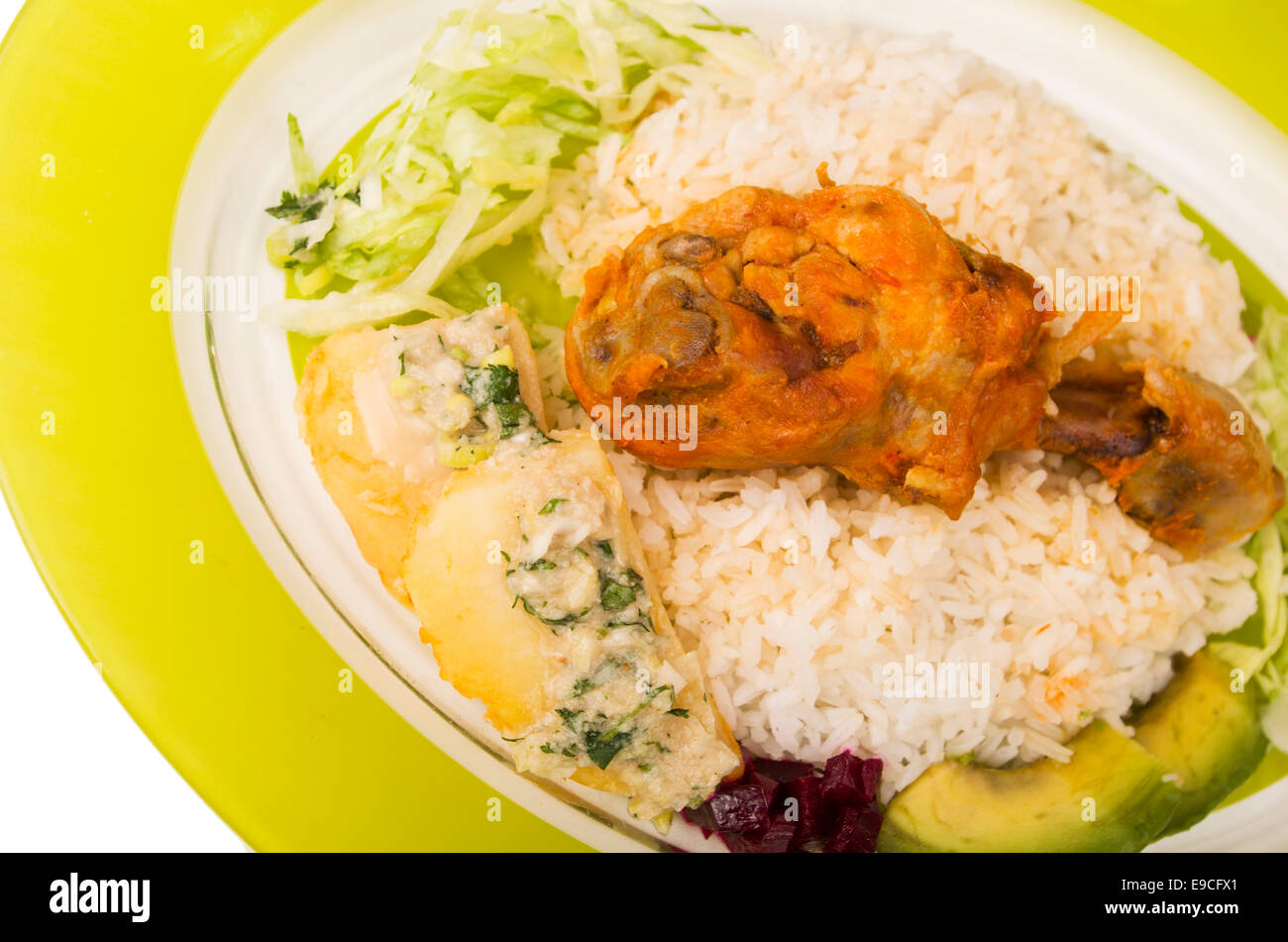 chicken served with white rice potato on a plate Stock Photo - Alamy