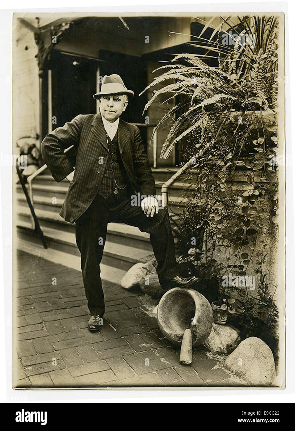 This image shows Reginaldo F. del Valle, a figure from the early 20th century, posing with a mortar and pestle. The photograph reflects his connection to scientific or medicinal work, likely in a professional context. Stock Photo