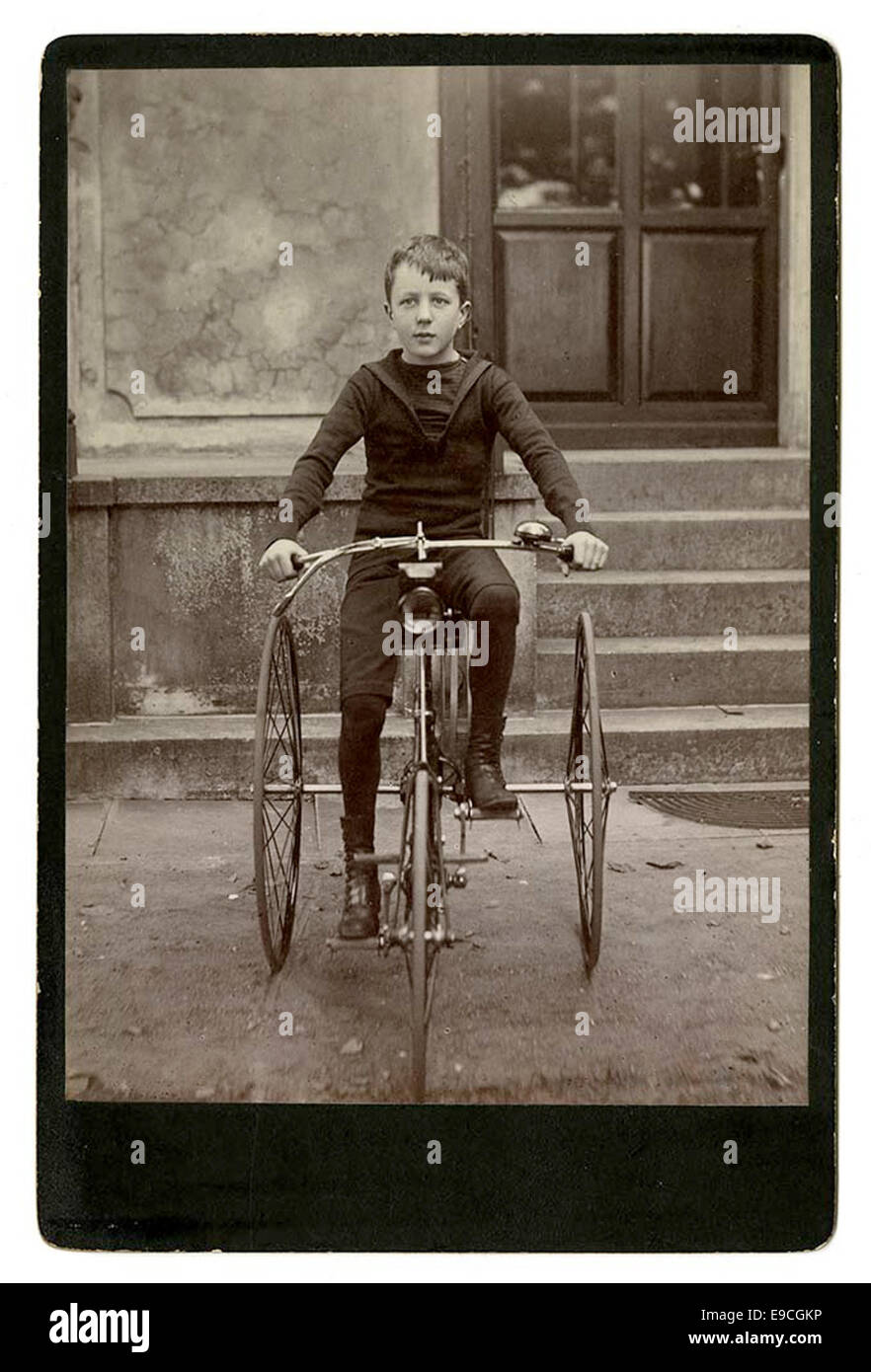 [Young boy on tricycle] Stock Photo Alamy