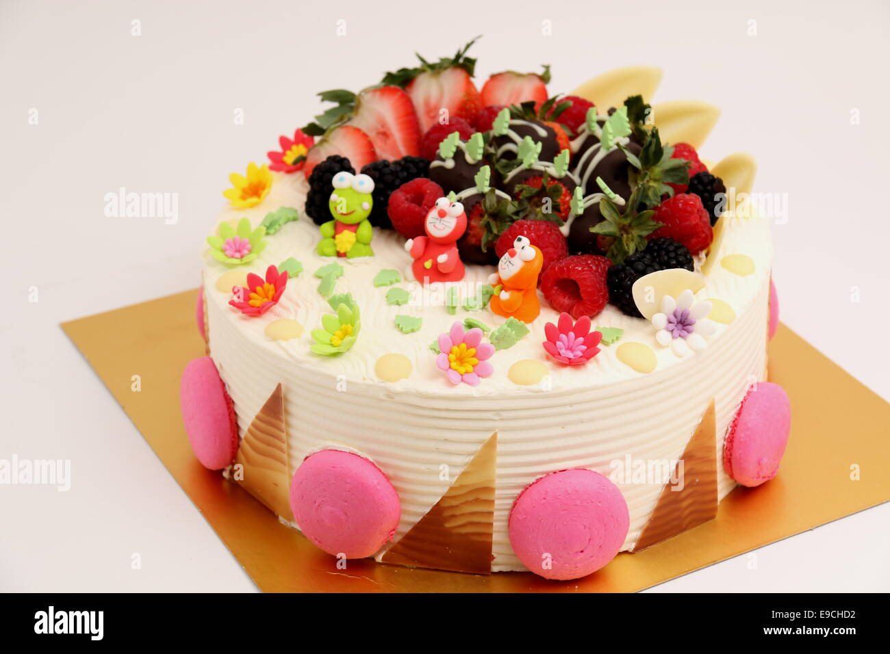 A Round Vanilla Cake Decorated With Fresh Fruits Stock Photo