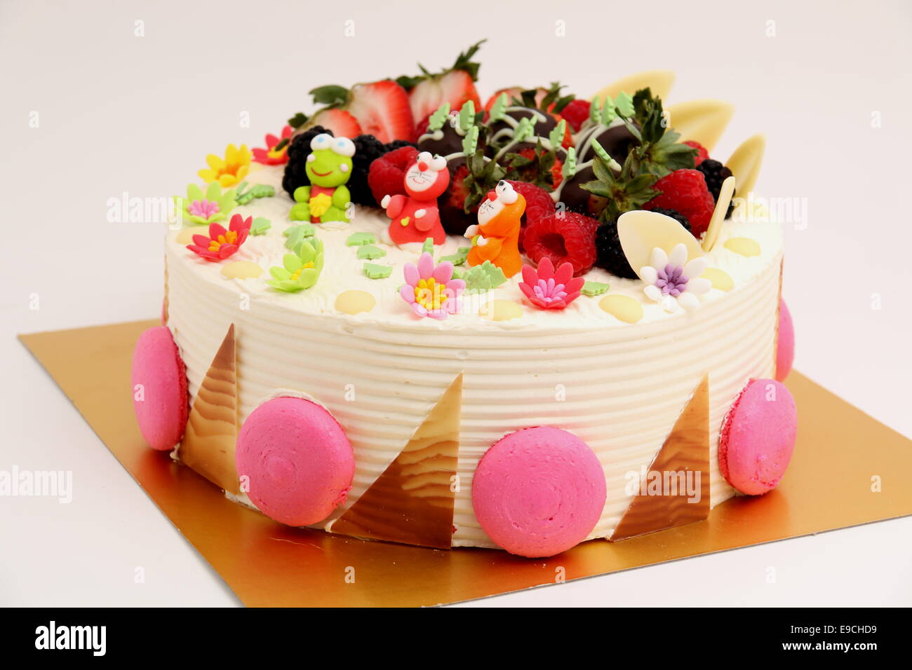 A Round Vanilla Cake Decorated With Fresh Fruits Stock Photo