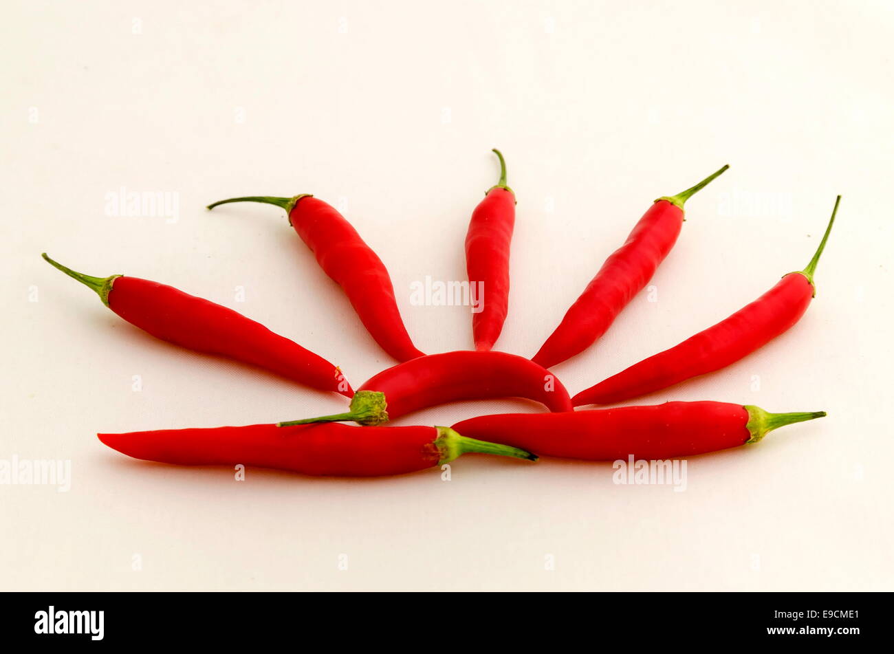 Sun figure with red chillis Stock Photo