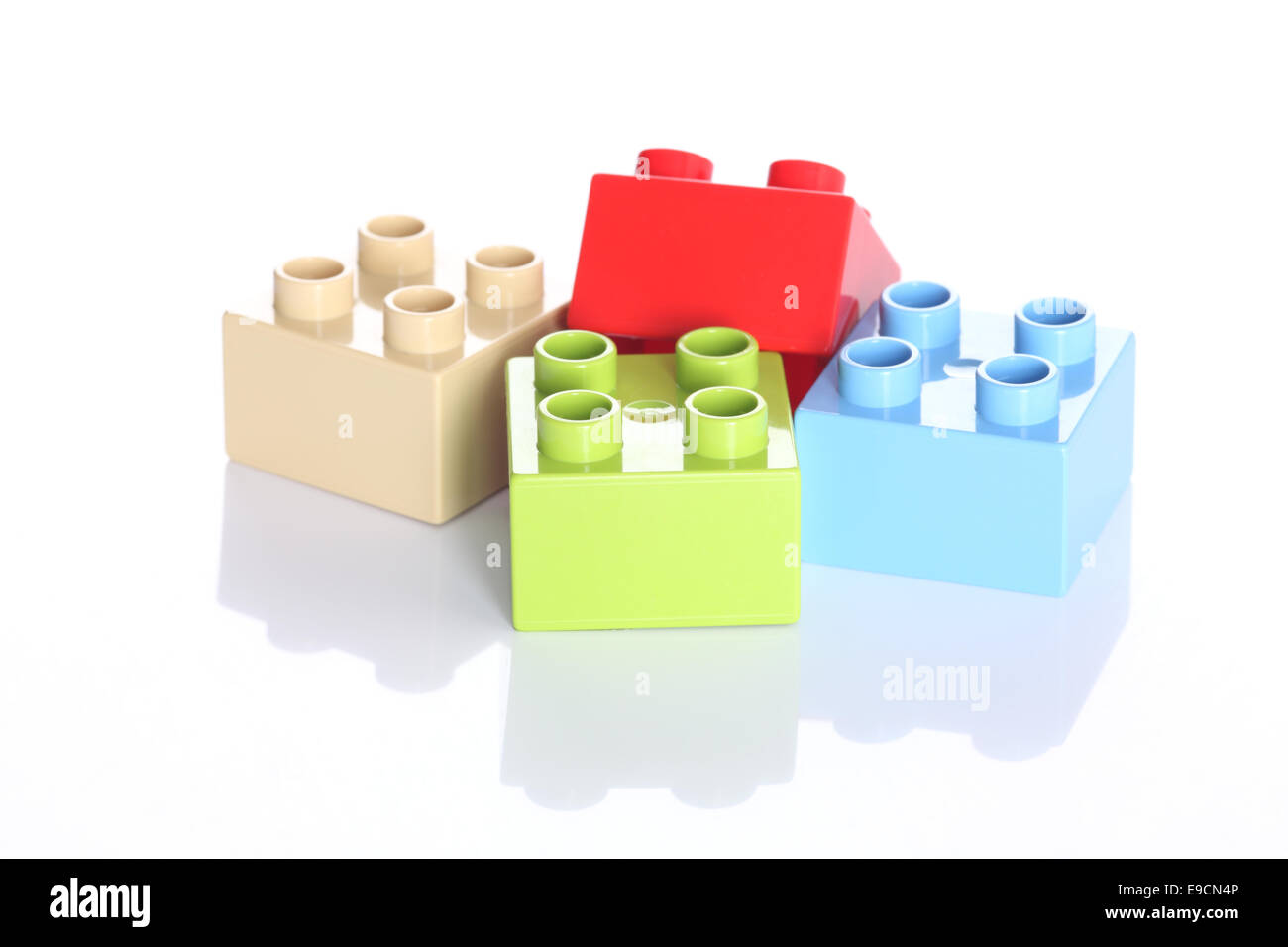 Plastic toy blocks on white background Stock Photo - Alamy