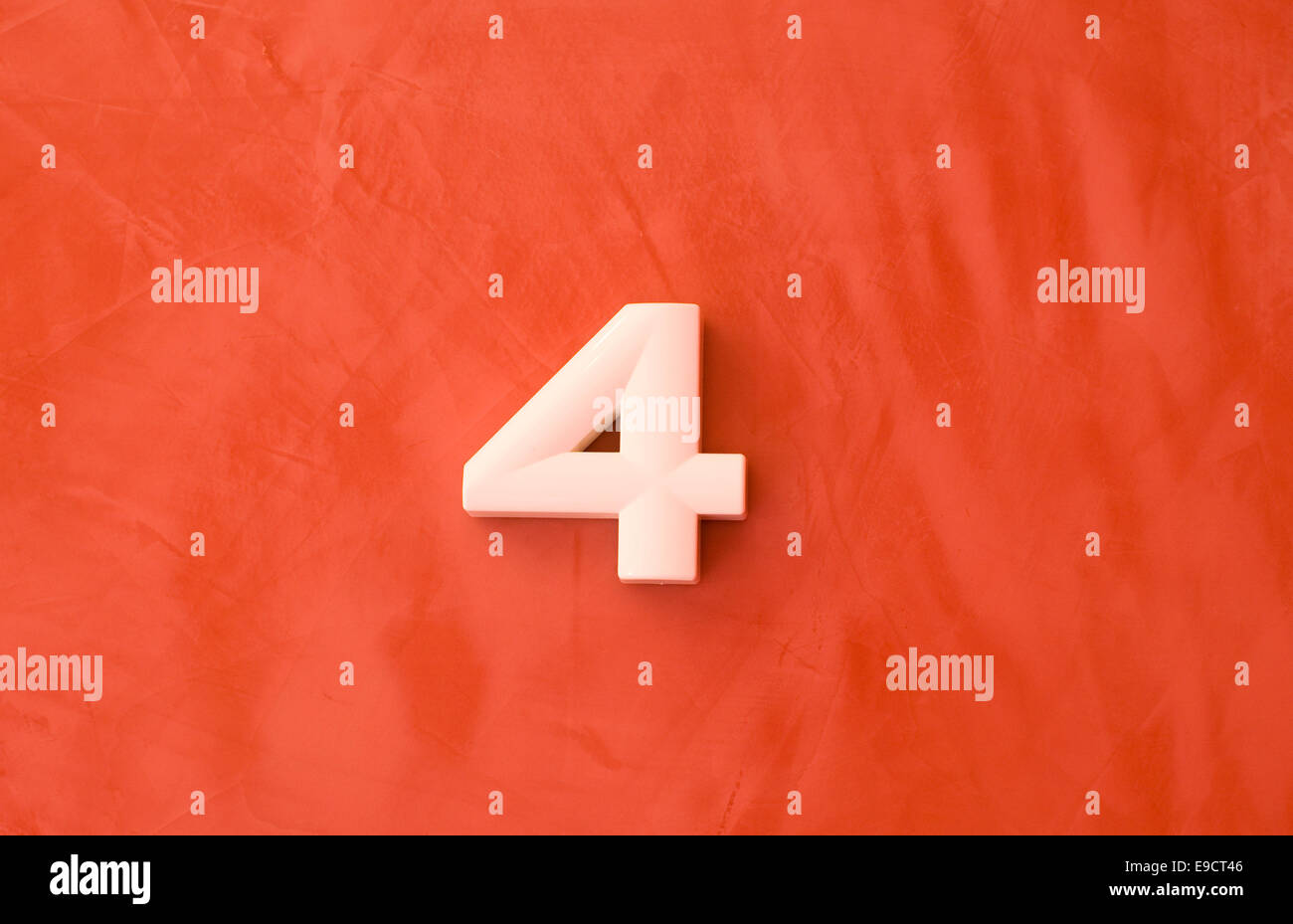 Number four 4 on red marble background Stock Photo