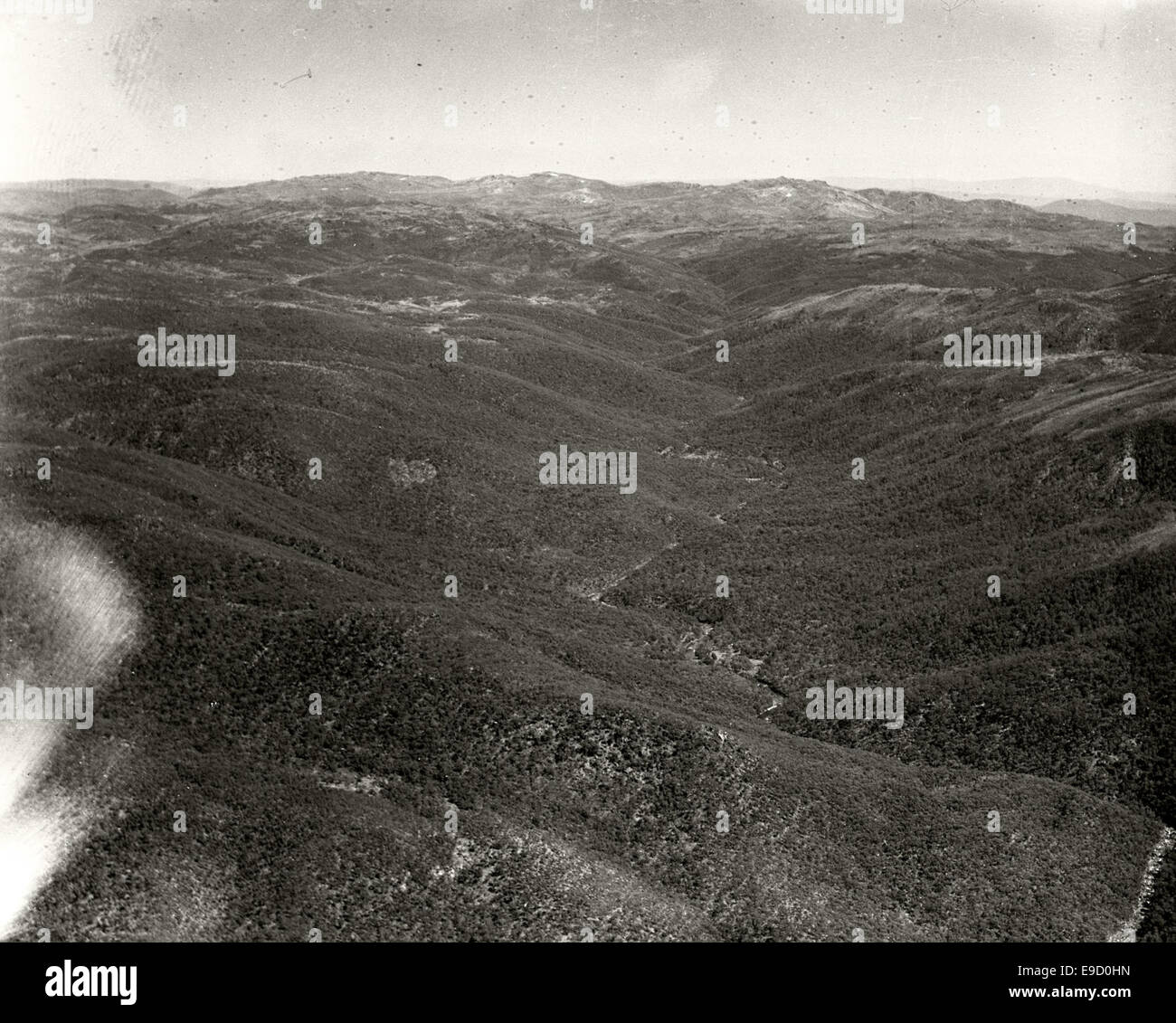 Aerial photograph from the 1936 Adastra Aerial Survey Collection, showing Kosciusko Summit and the Snowy River Gorge. The image captures the natural beauty and rugged landscape of the Snowy Mountains in Australia. Stock Photo